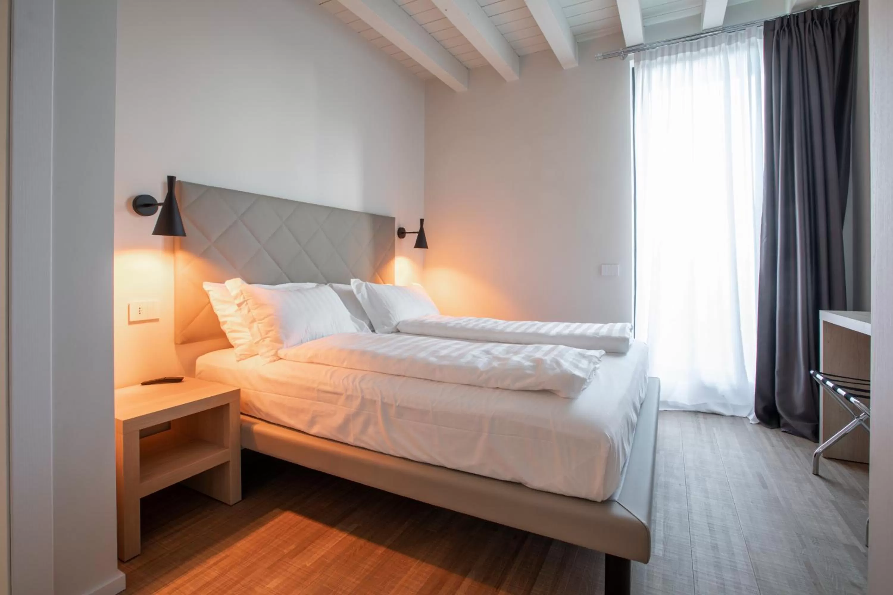Bed in Ah Villaglori Boutique Apartments
