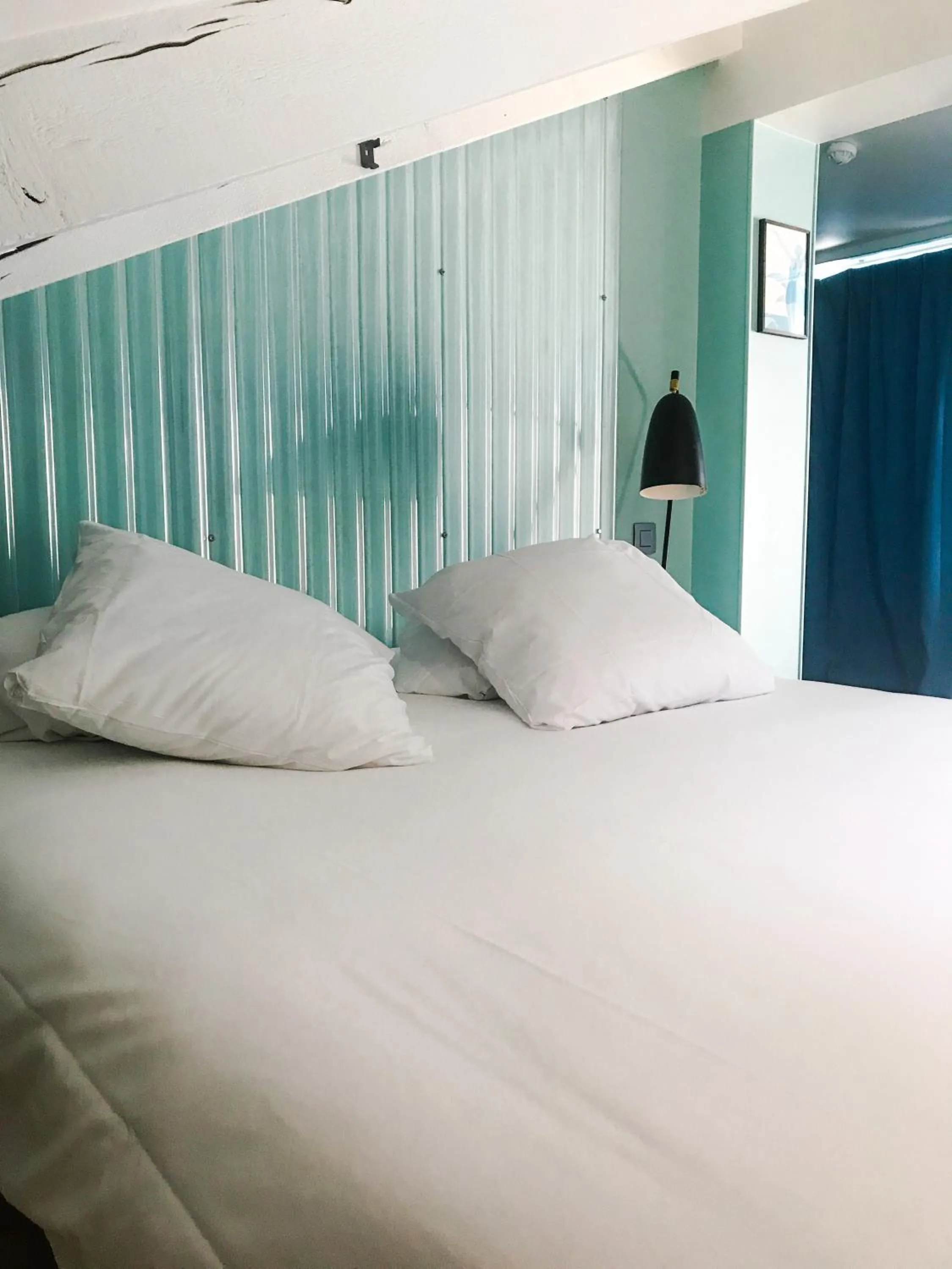 Bed in Hôtel Ozz by Happyculture