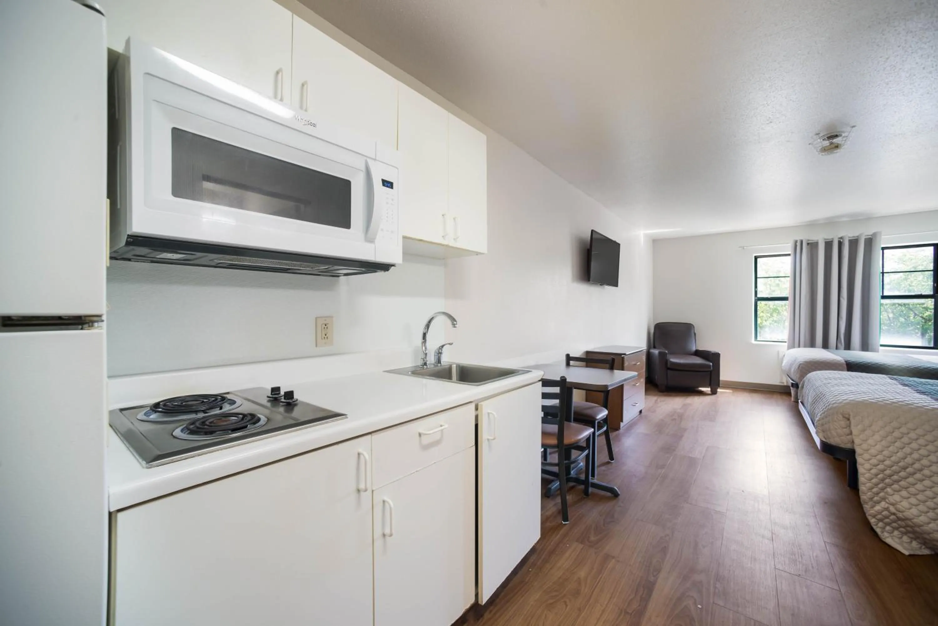 Photo of the whole room in HomeTowne Studios by Red Roof St. Louis - Airport/N Lindbergh