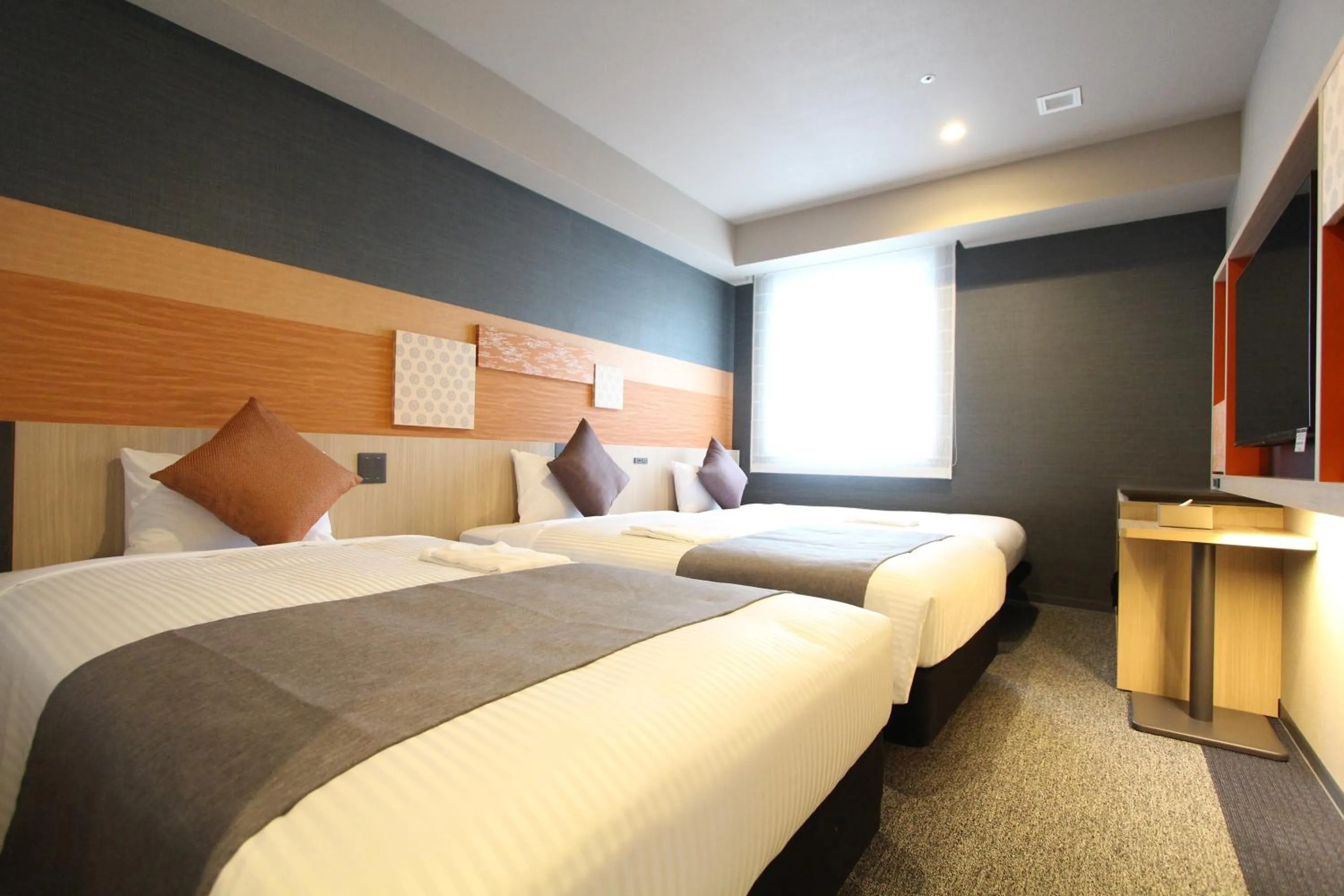 Bed in KOKO HOTEL Tsukiji Ginza