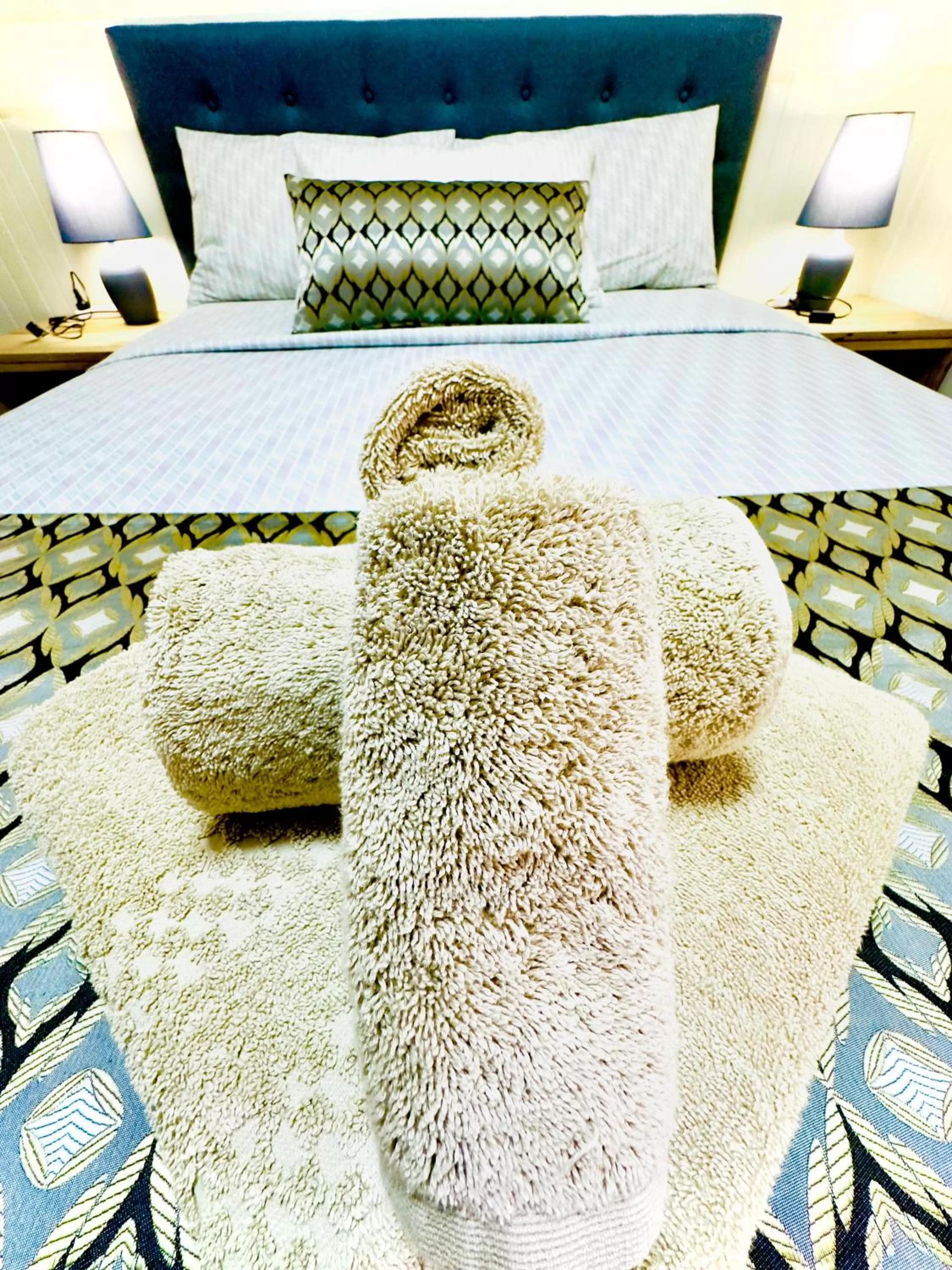 Bed in Auto Lodge Motor Inn