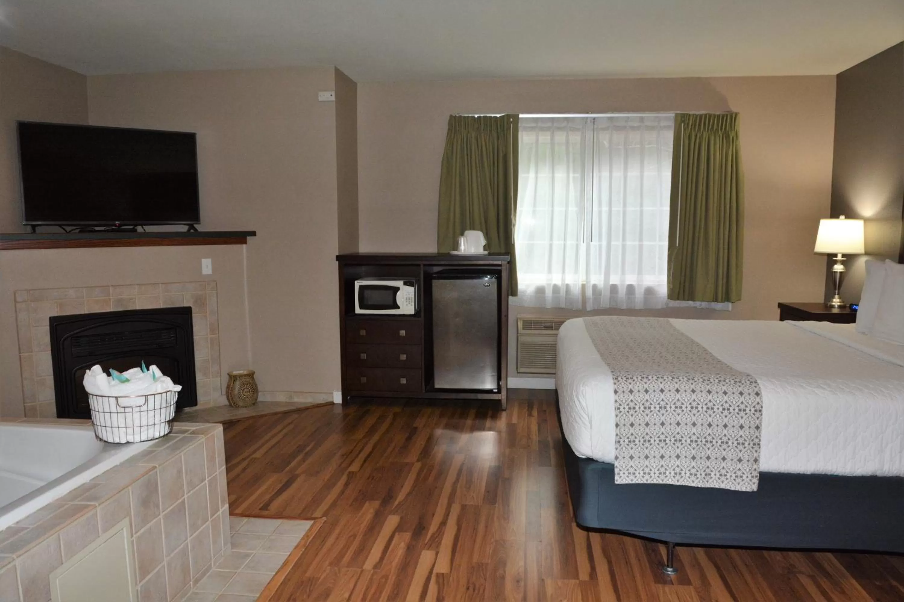 Bed in FairBridge Inn & Suites DuPont