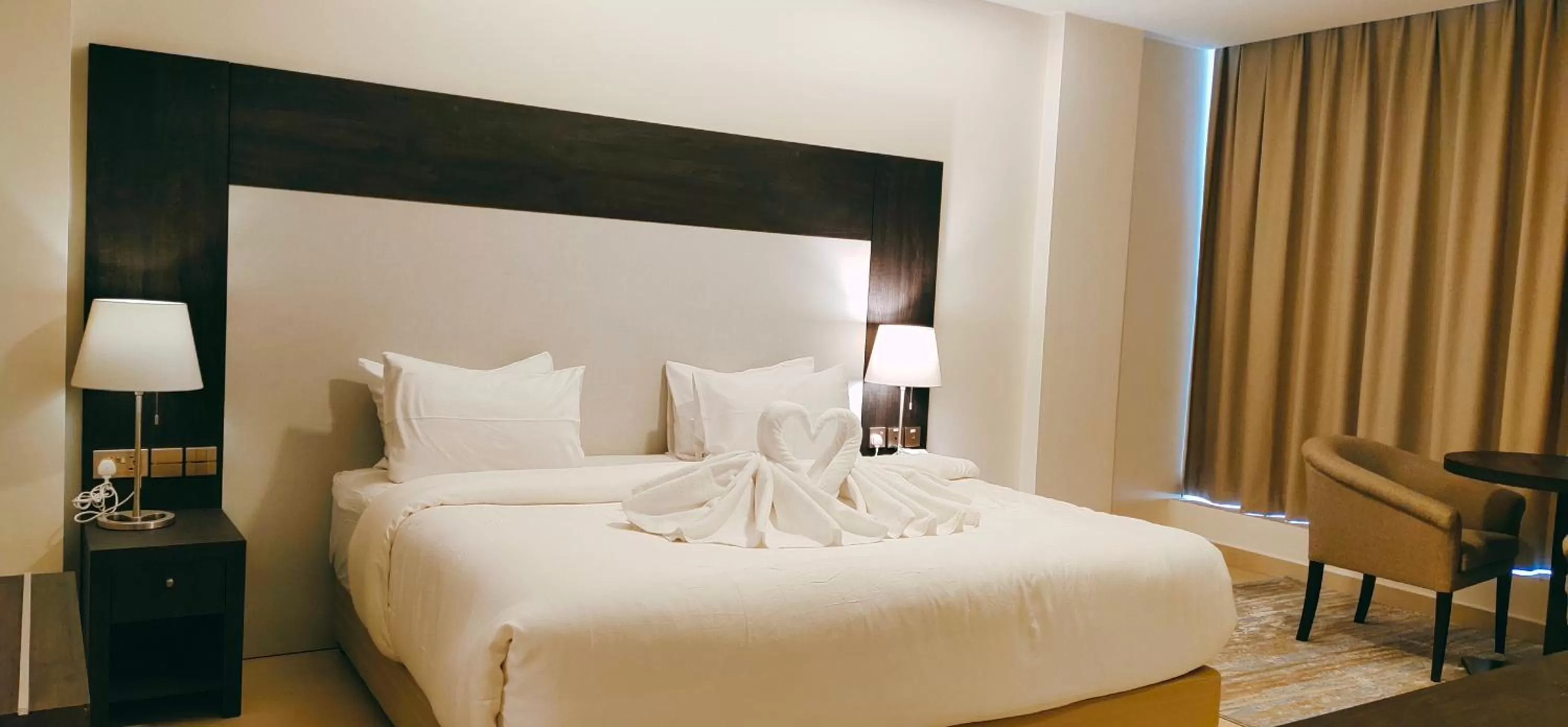 Bed in Manazil Aldar Hotel