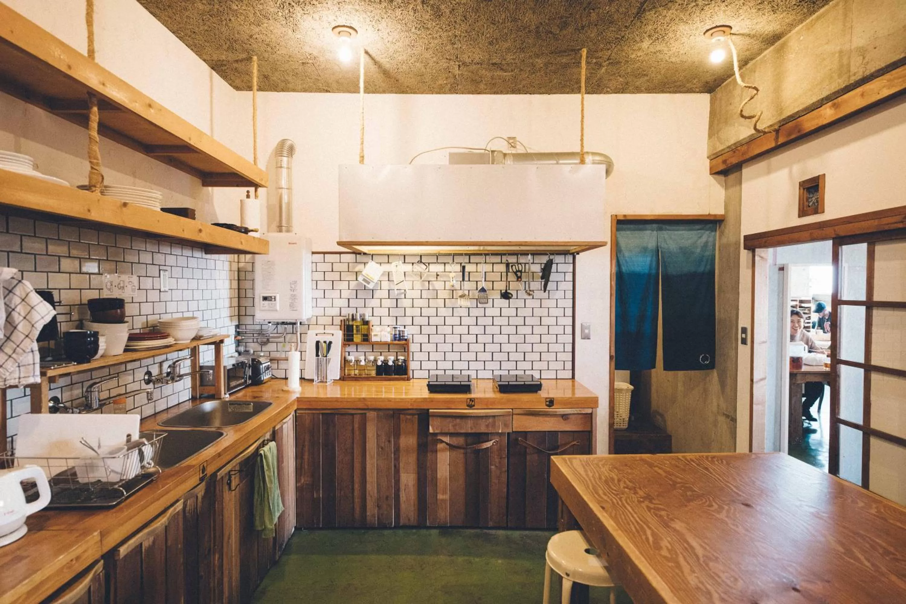 Communal kitchen in Nui. HOSTEL & BAR LOUNGE