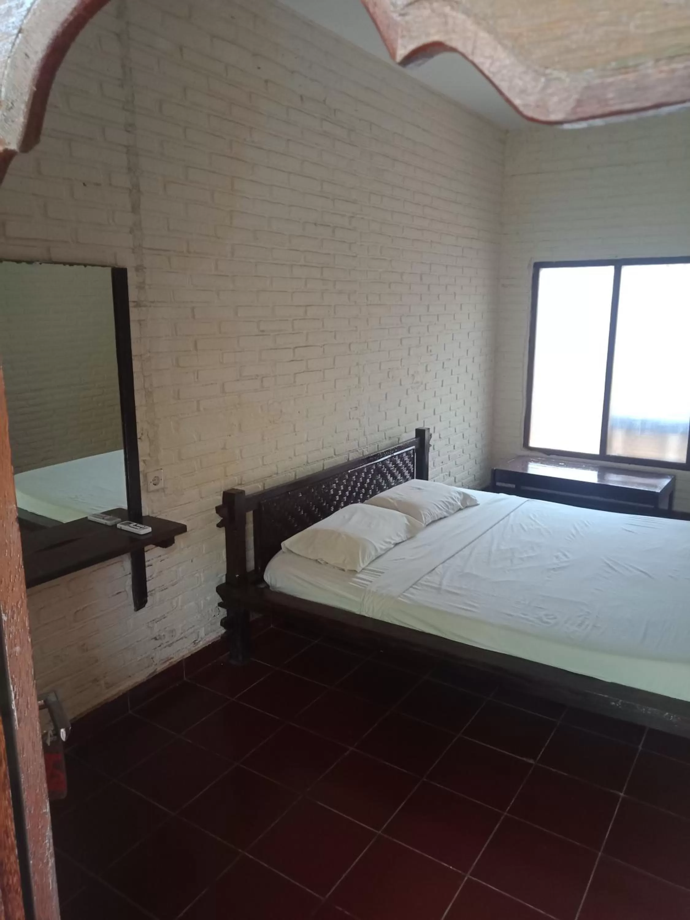 Bed in Nirwana Sea Side Cottages