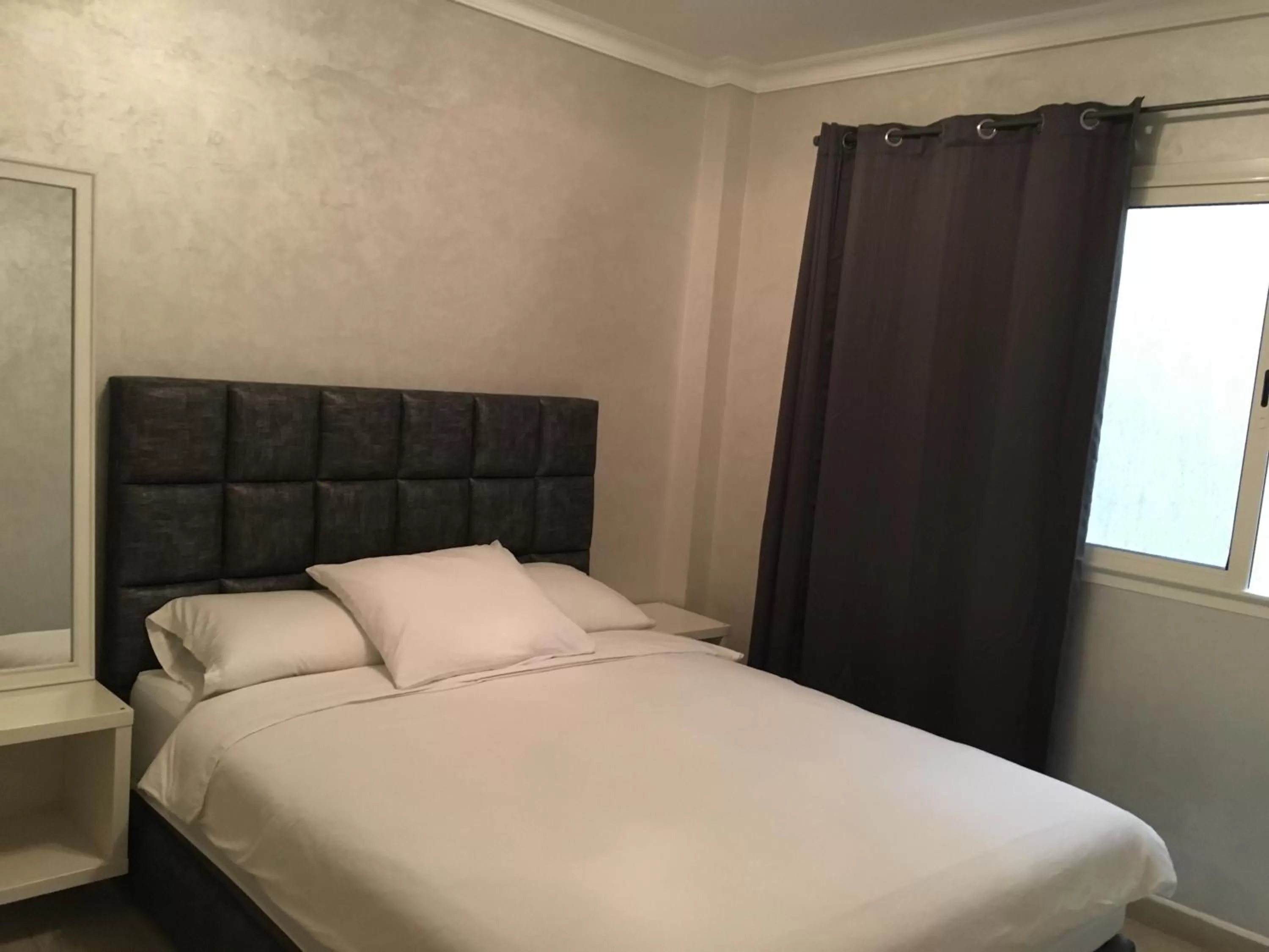 Bed in Appart Hotel Monaco