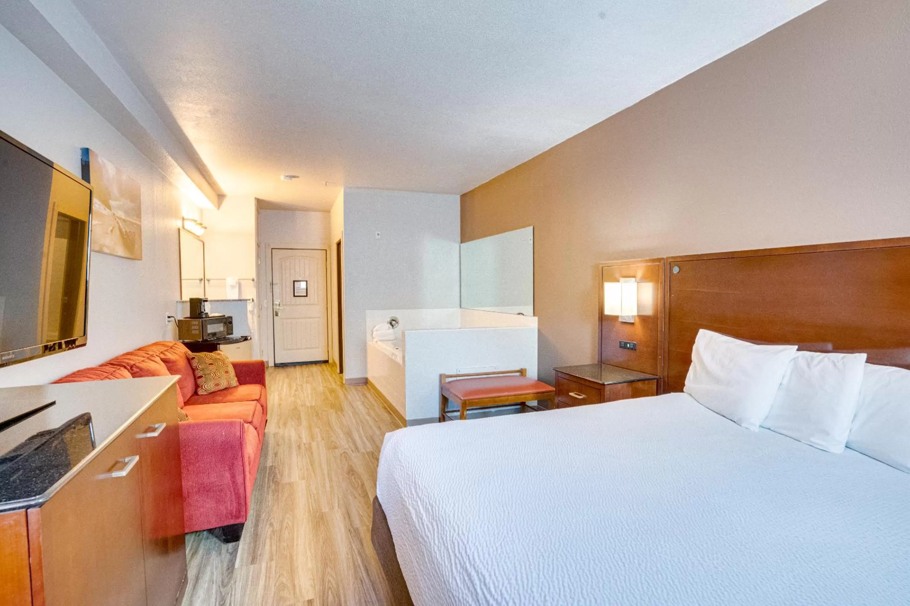 Bed in The Ashley Inn & Suites