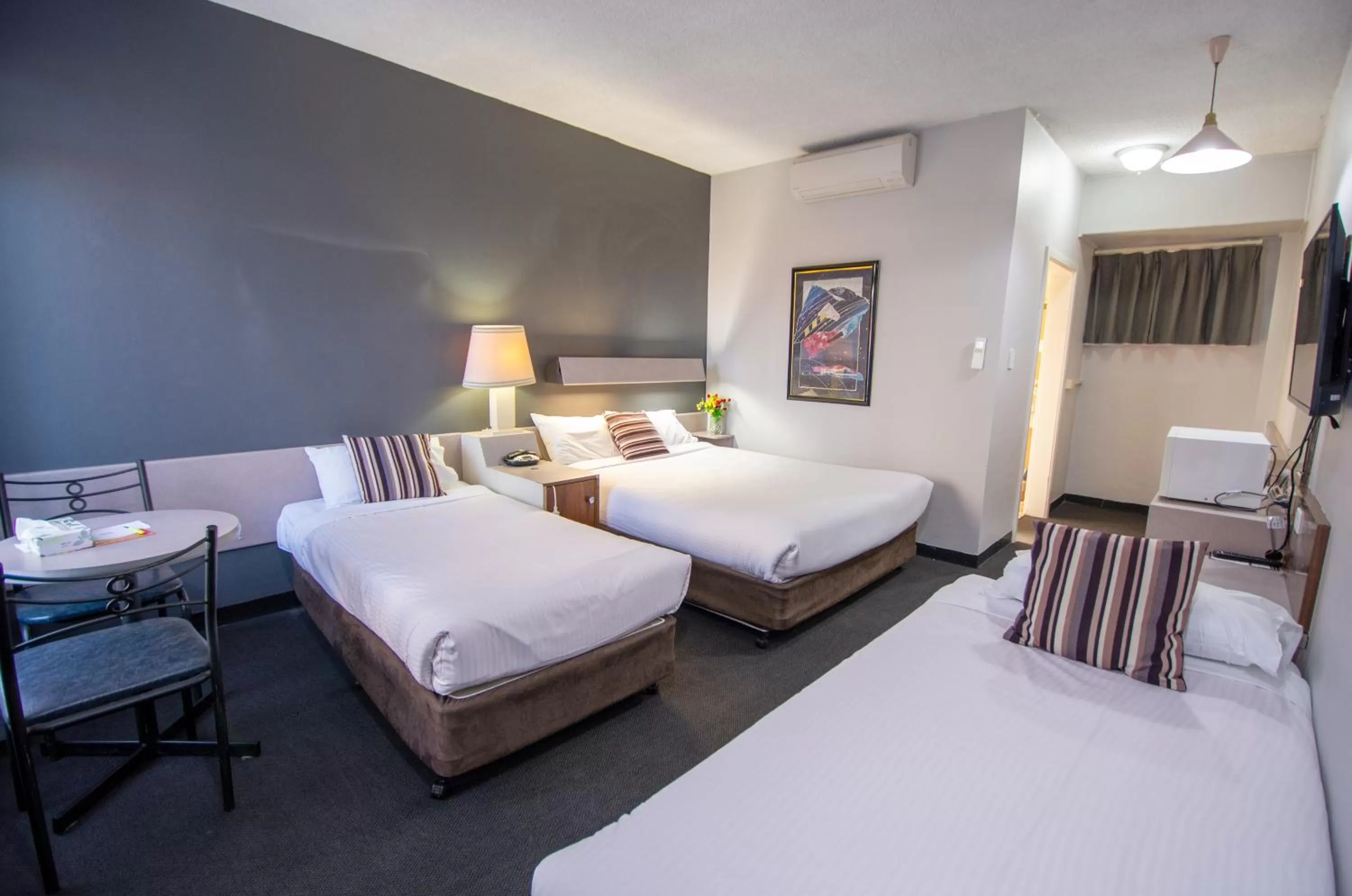 Bed in The Midcity Motor Lodge