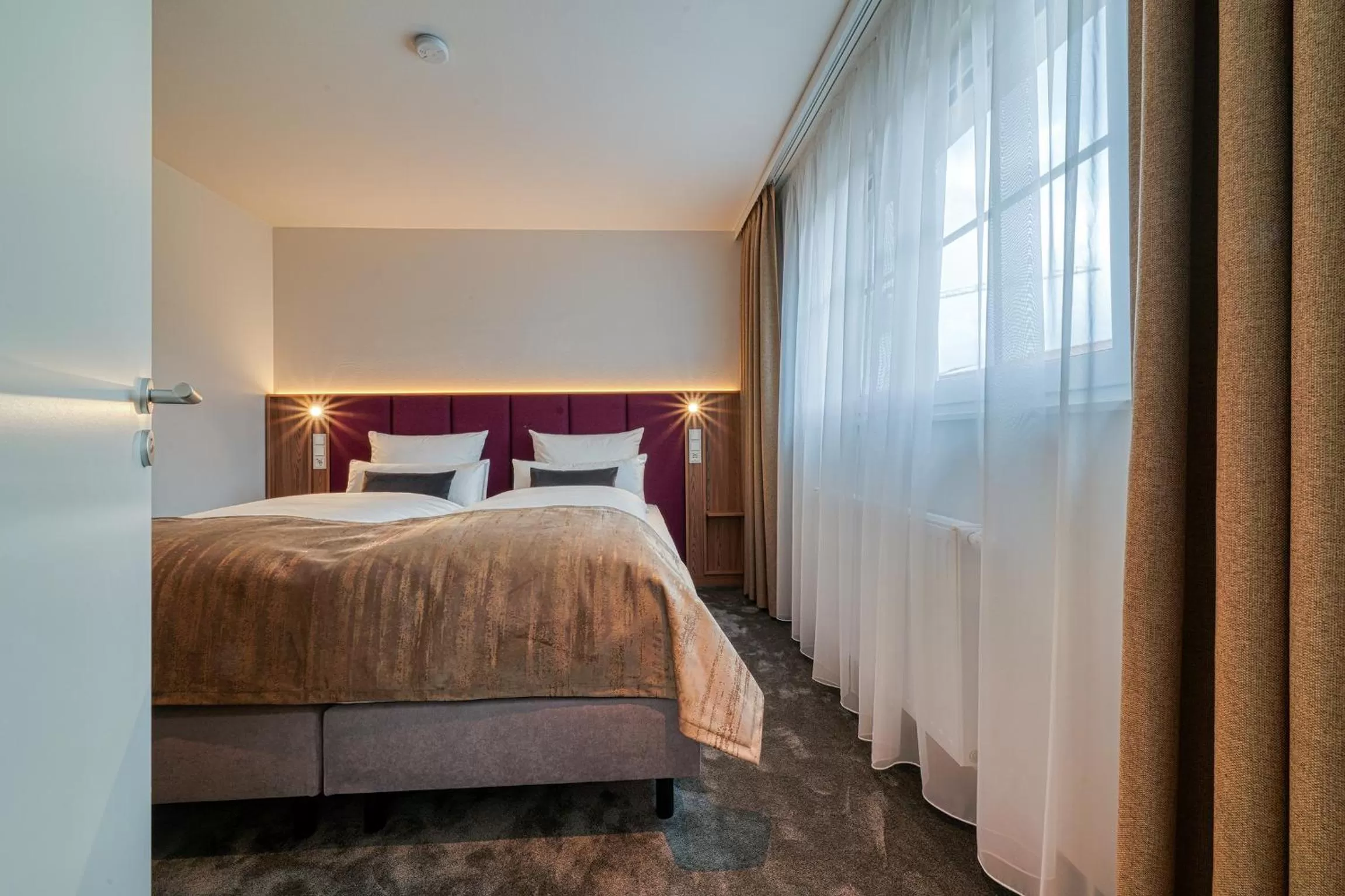 Bed in FourSide Hotel Ringsheim, Trademark Collection by Wyndham