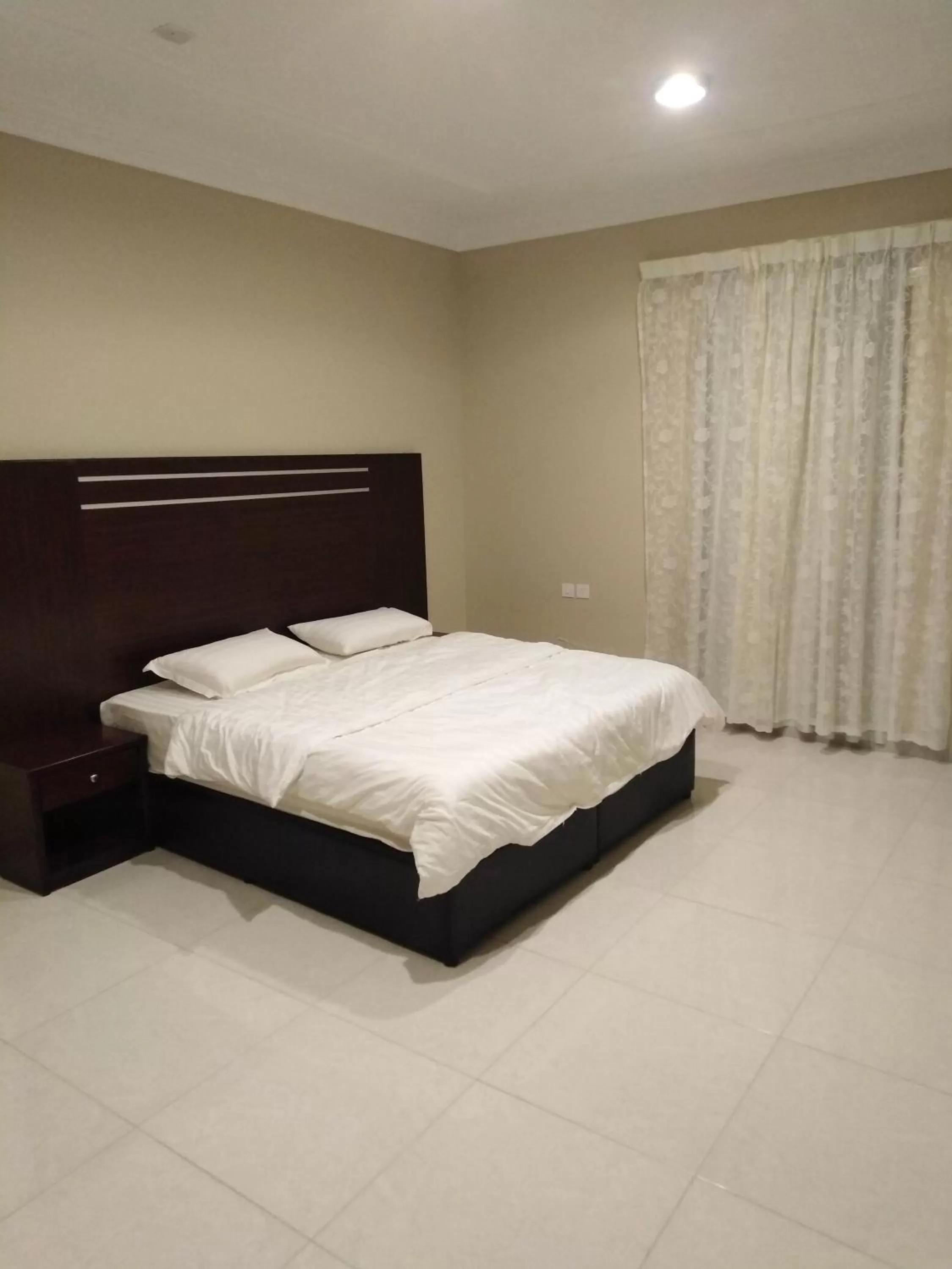 Bed in Sunrise Furnished Apartment