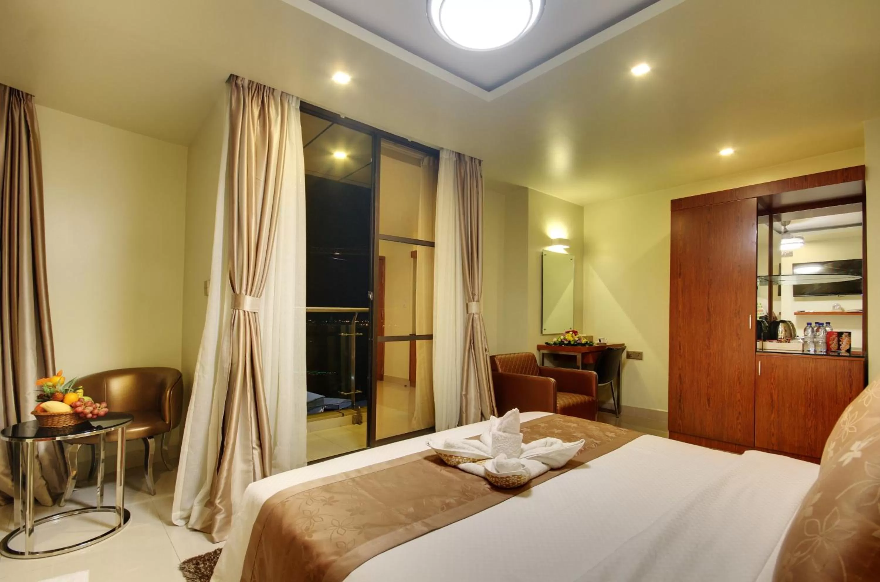 Photo of the whole room, Bed in Unima Grand