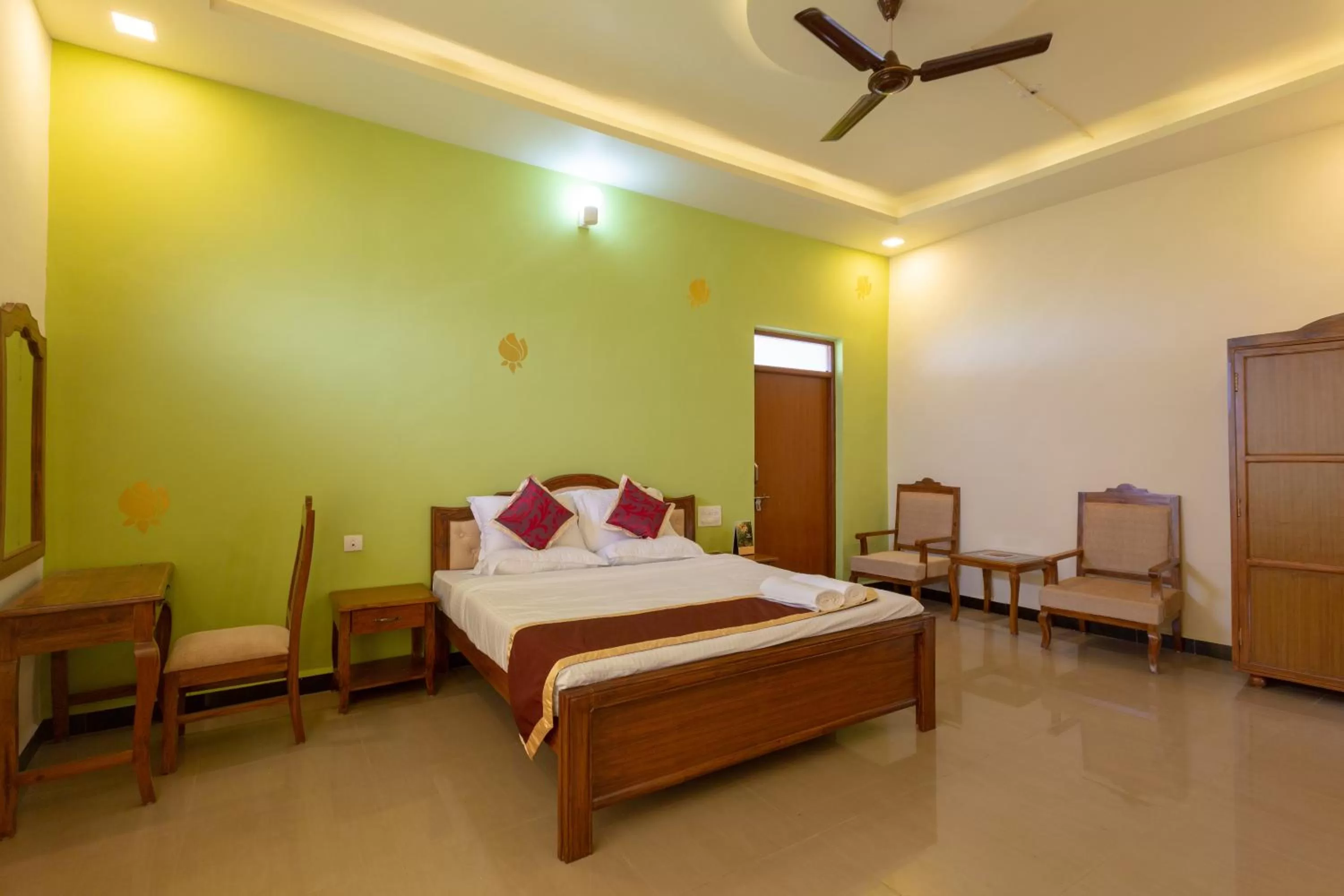 Bed in KSTDC Hotel Mayura Krishna Almatti