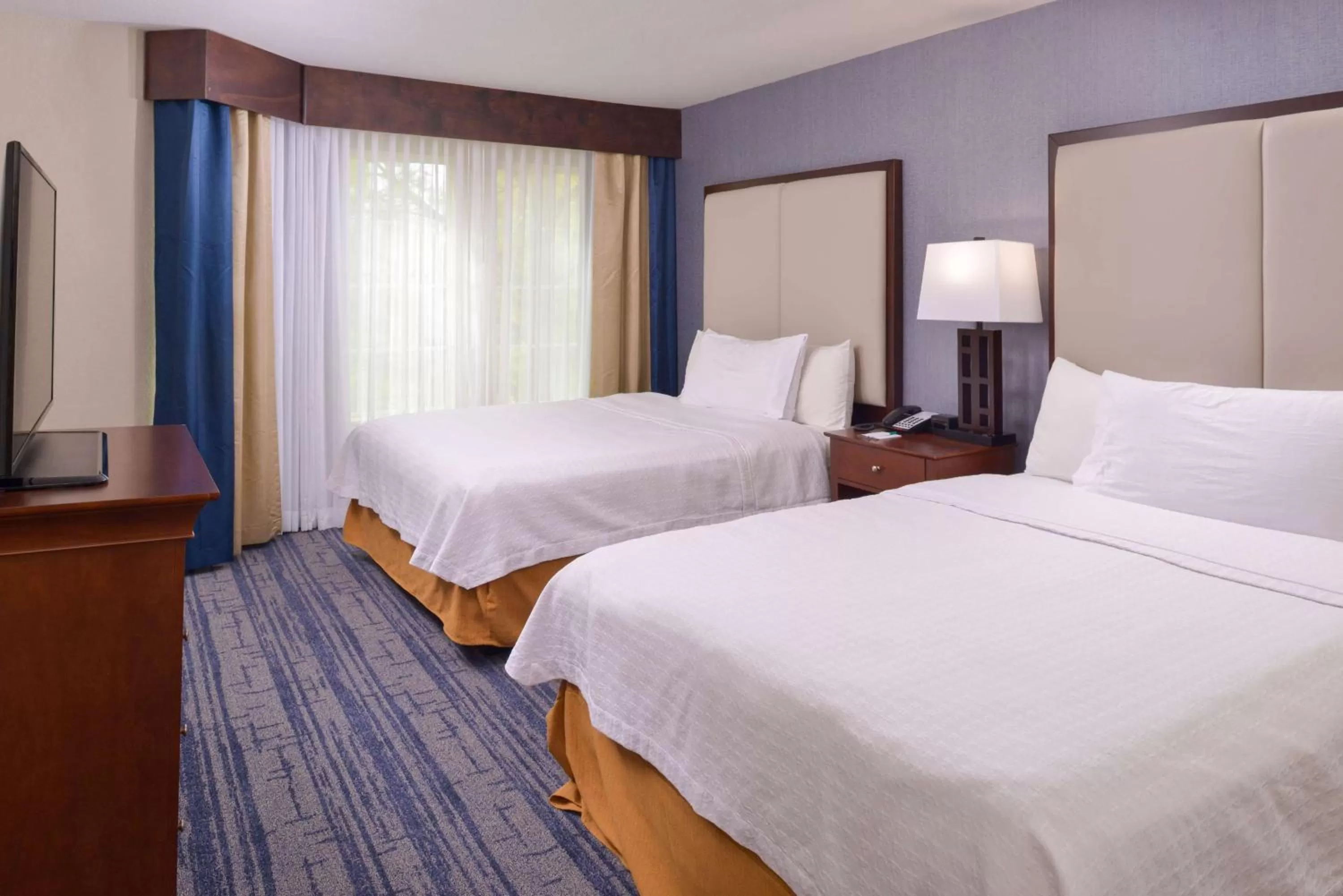 Bed in Homewood Suites by Hilton Dallas-Lewisville