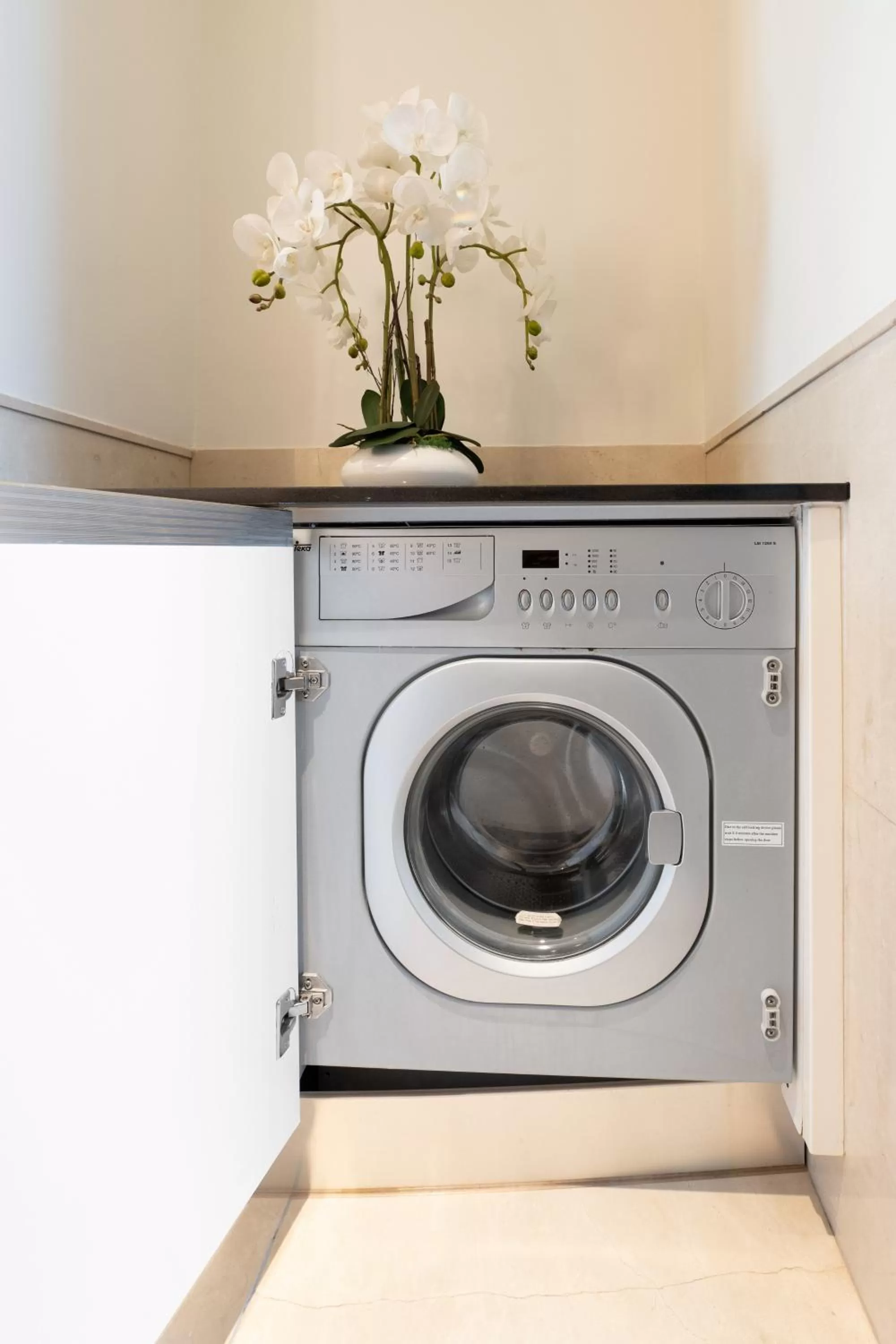 washing machine in Emaar Residences Dubai Marina by Qstay - formerly Address Dubai Marina