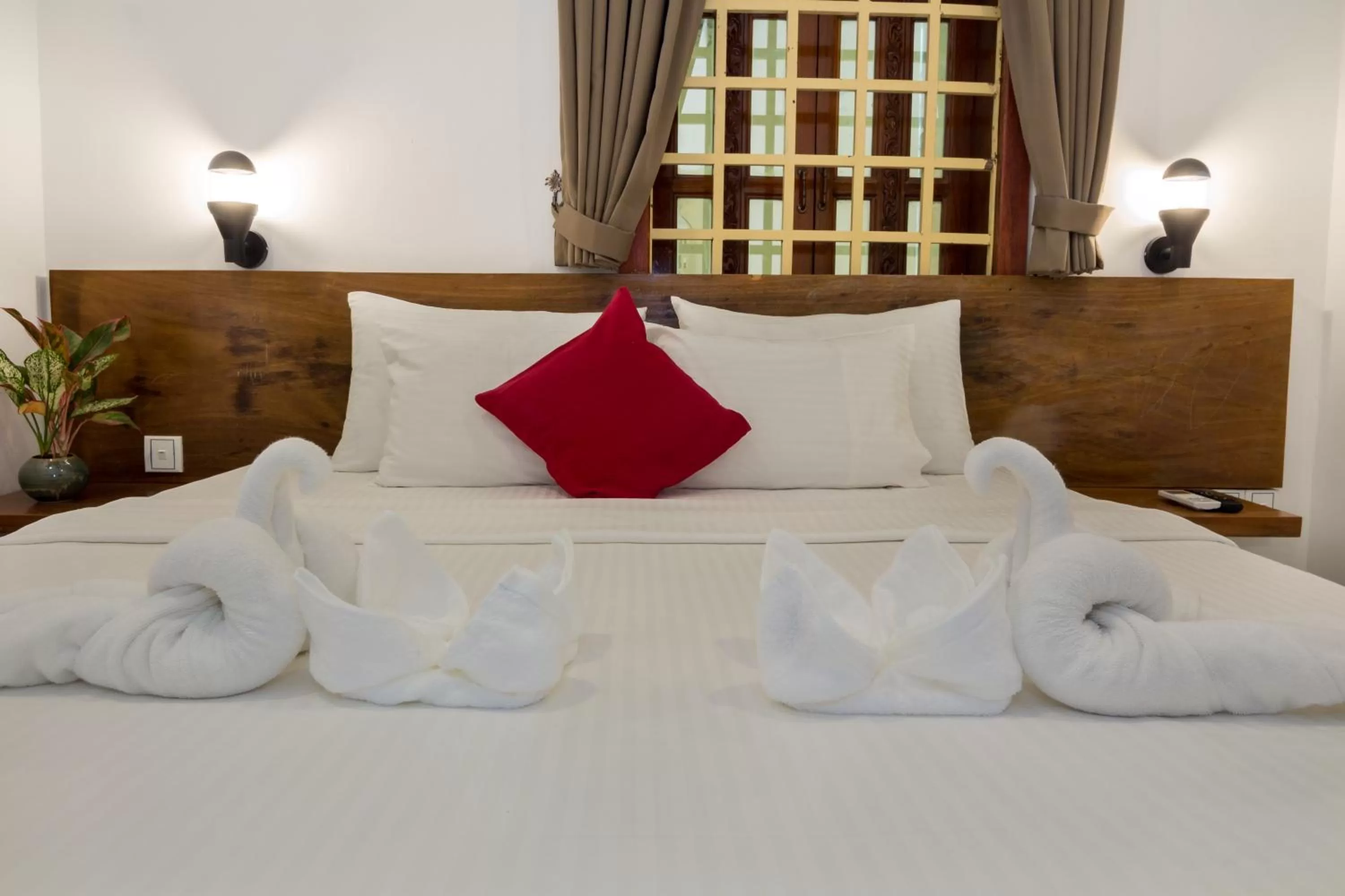 Bed in Poolside Villa