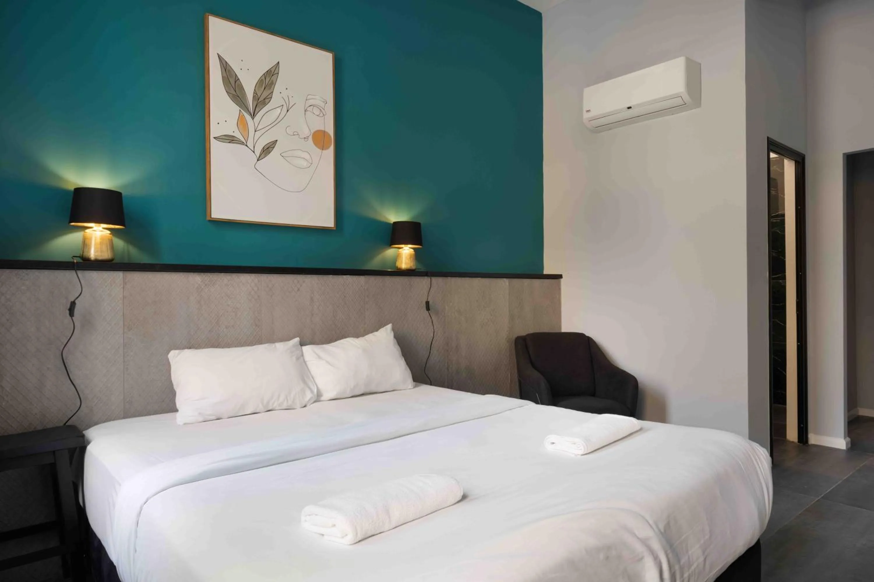 Photo of the whole room, Bed in Liber Tel Aviv Sea Shore Suites BY RAPHAEL HOTELS