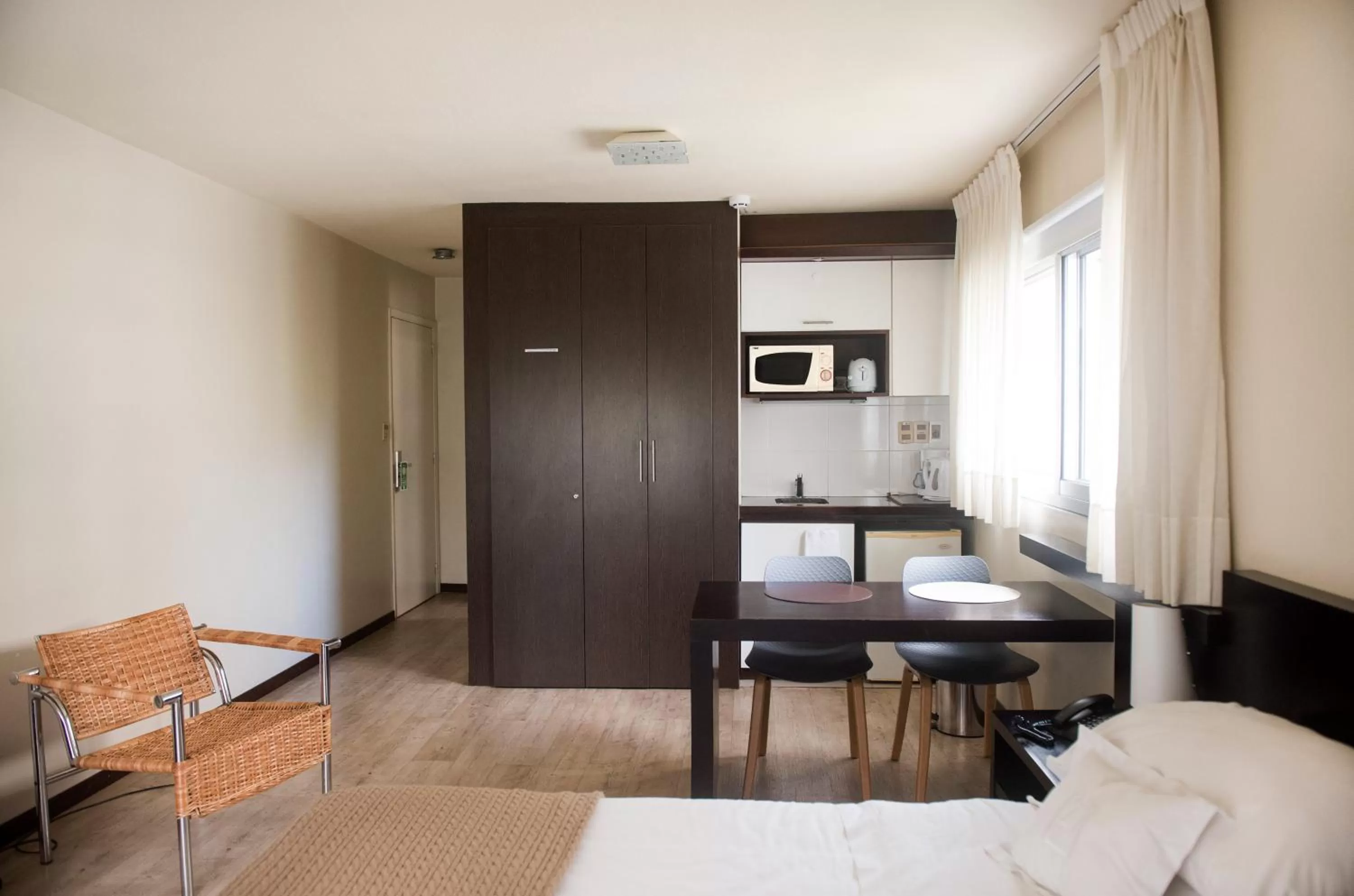 Kitchen or kitchenette, Bed in 27 Suites Hotel