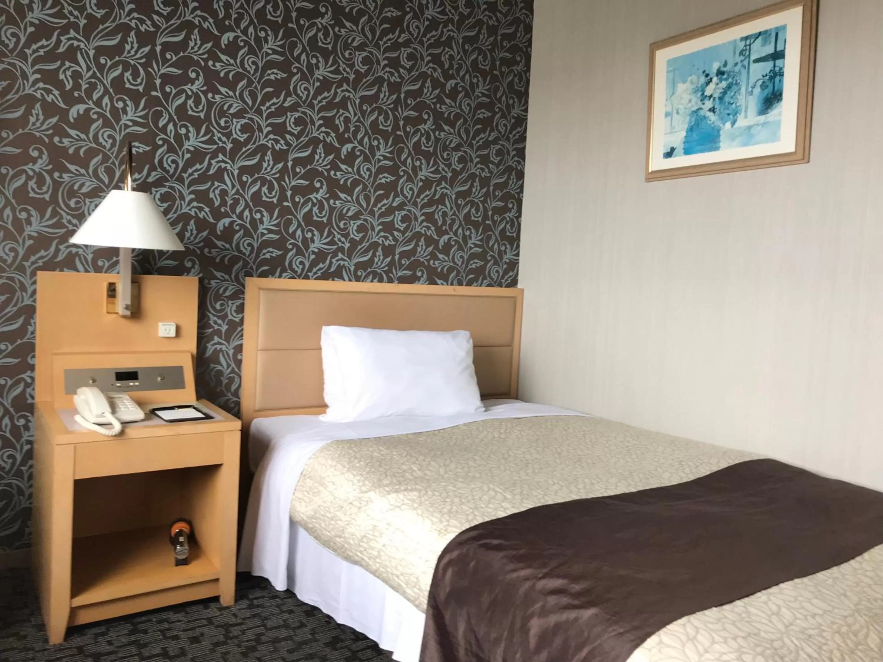 Bed in Numazu River Side Hotel