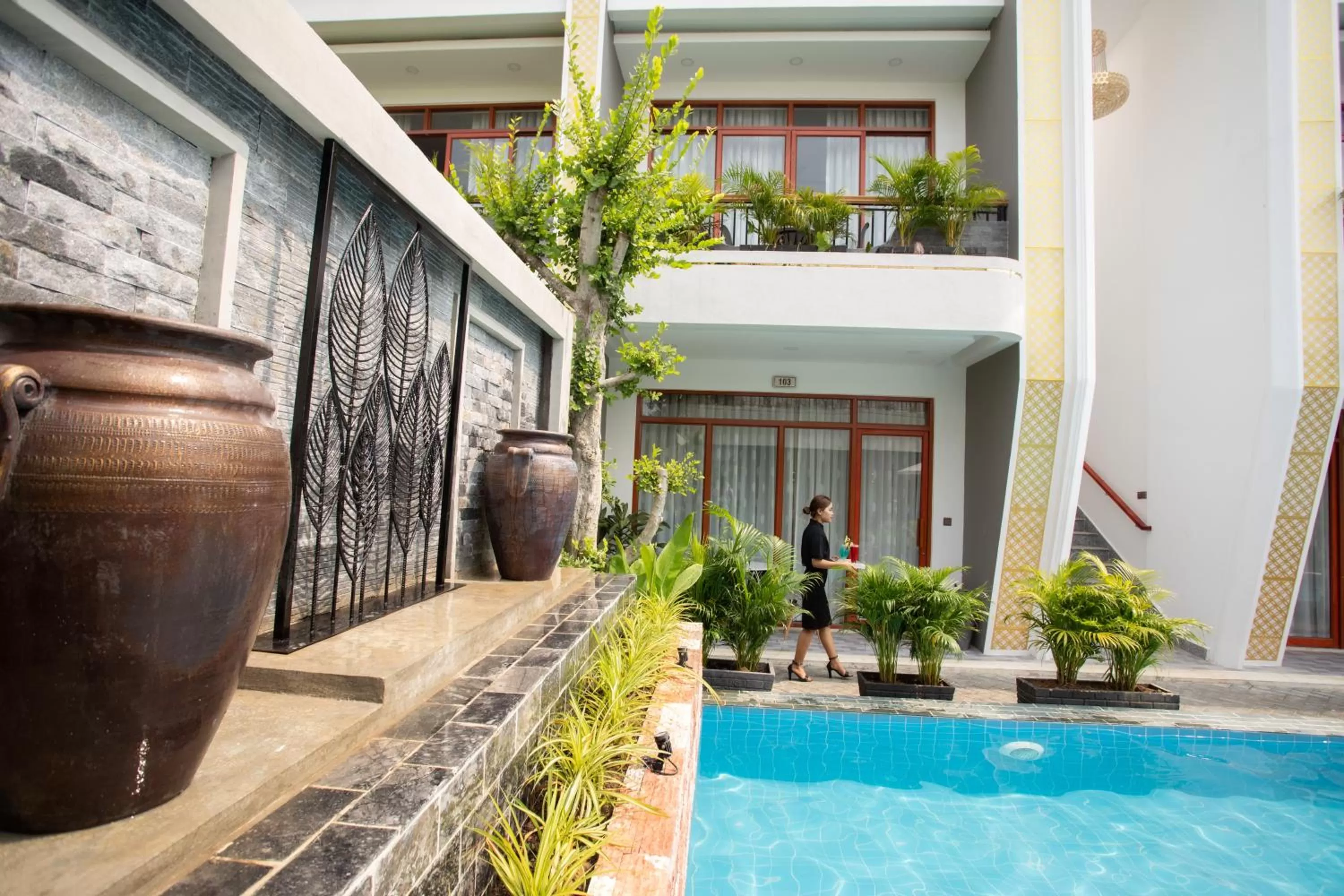 Swimming pool in Cambana La Riviere Boutique