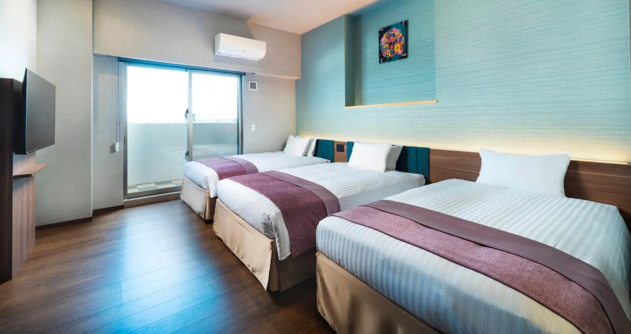 Bed in HOTEL SANSUI NAHA Ryukyu Onsen Naminoue-No-Yu