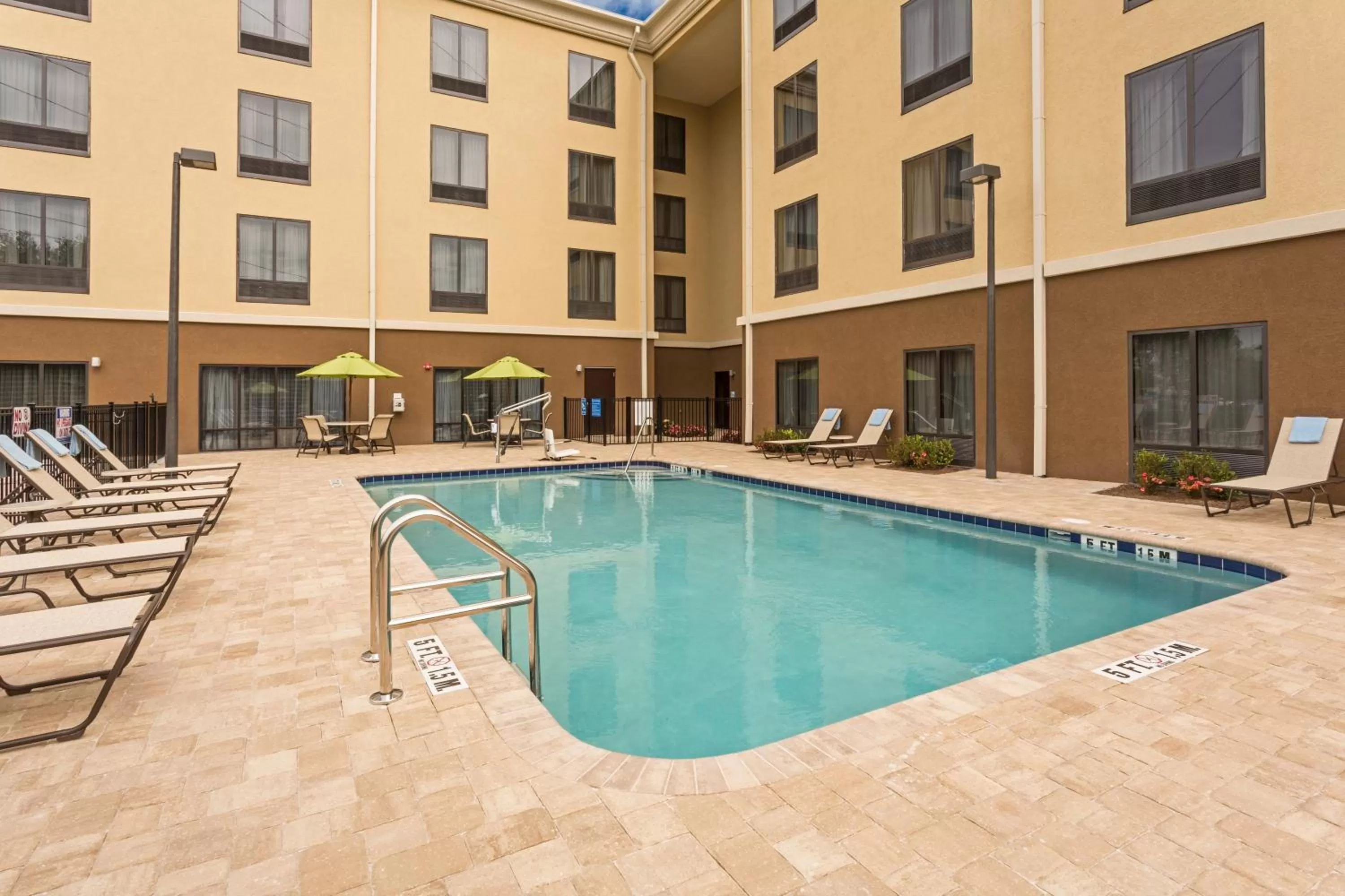 Swimming pool in Holiday Inn Express Hotel & Suites Orlando East-UCF Area by IHG