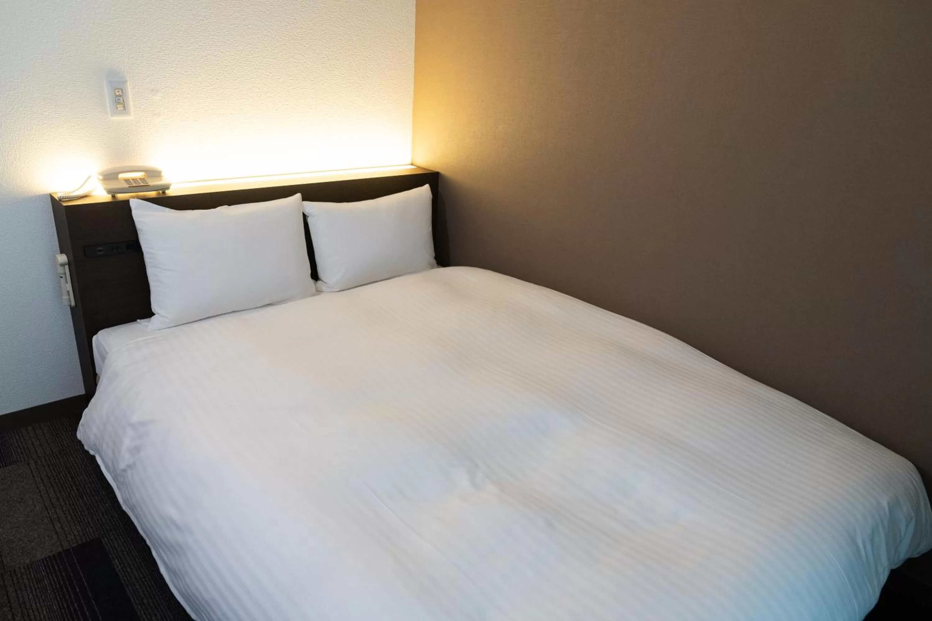 Photo of the whole room, Bed in Heiwadai Hotel Tenjin