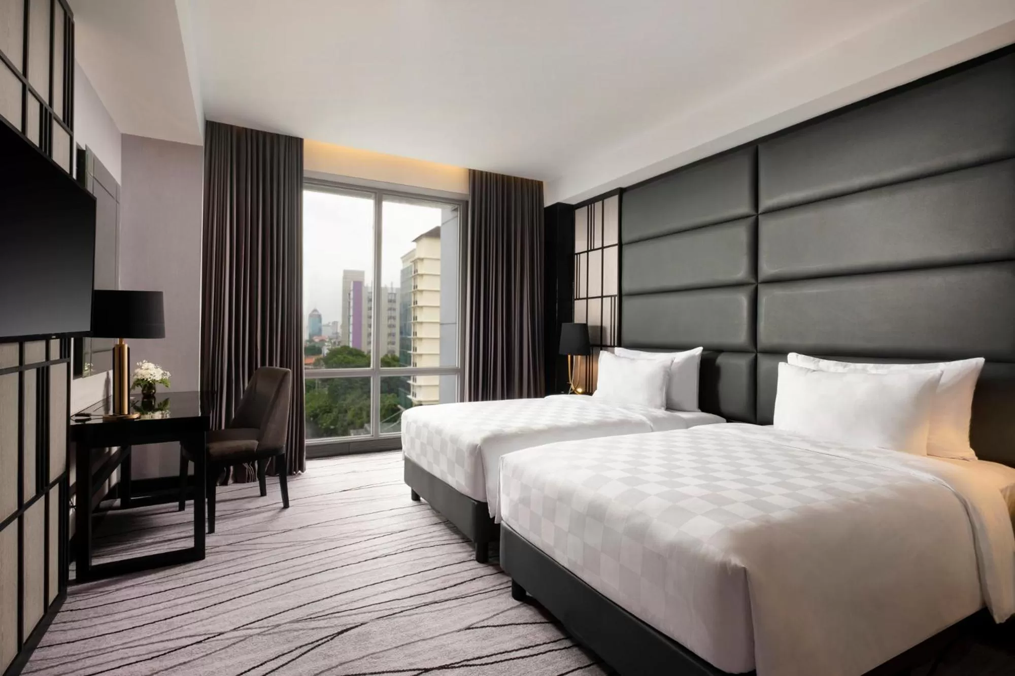 Bed in Grand Swiss-Belhotel Darmo