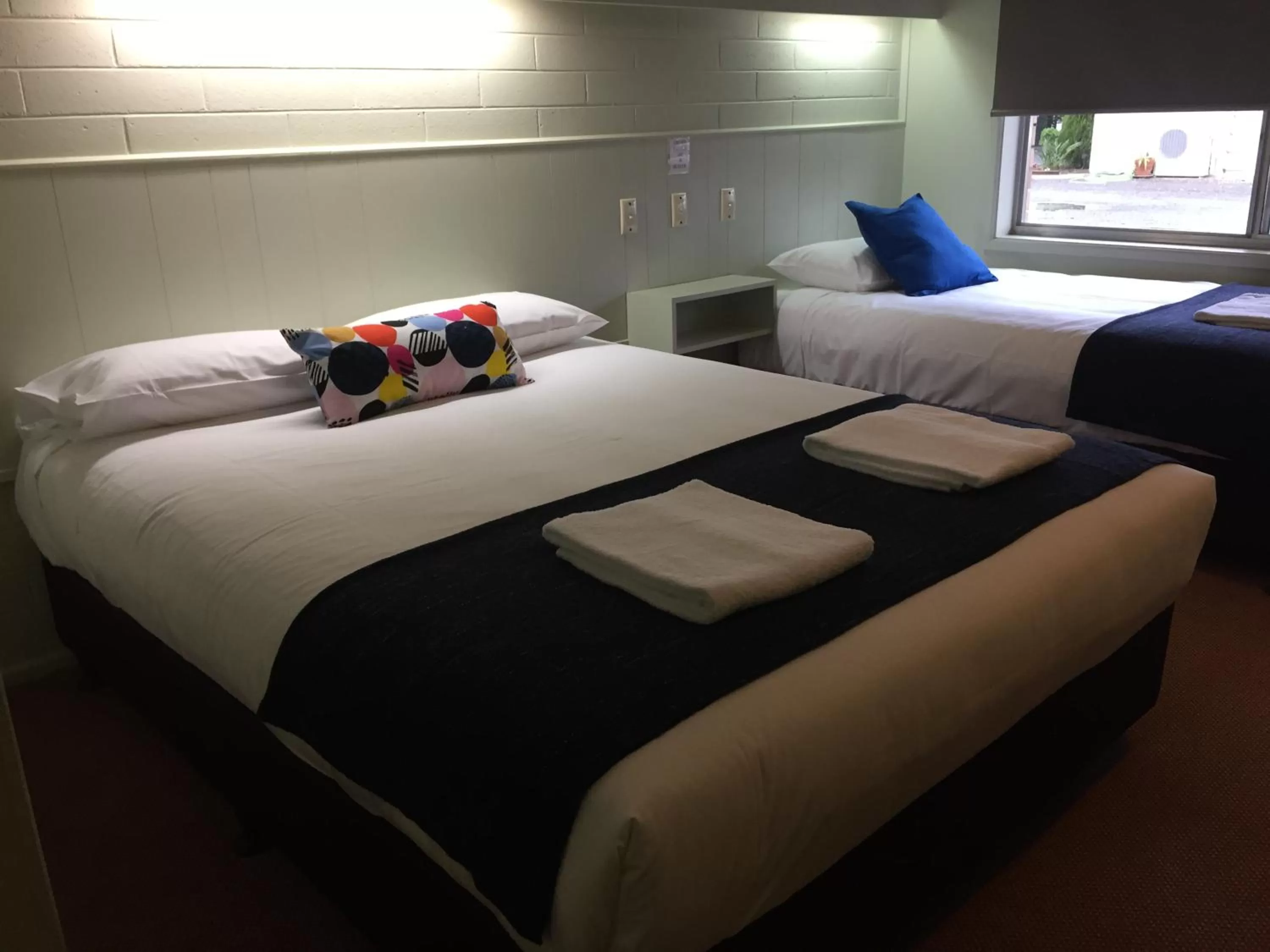 Bed in Finley Country Club Hotel Motel