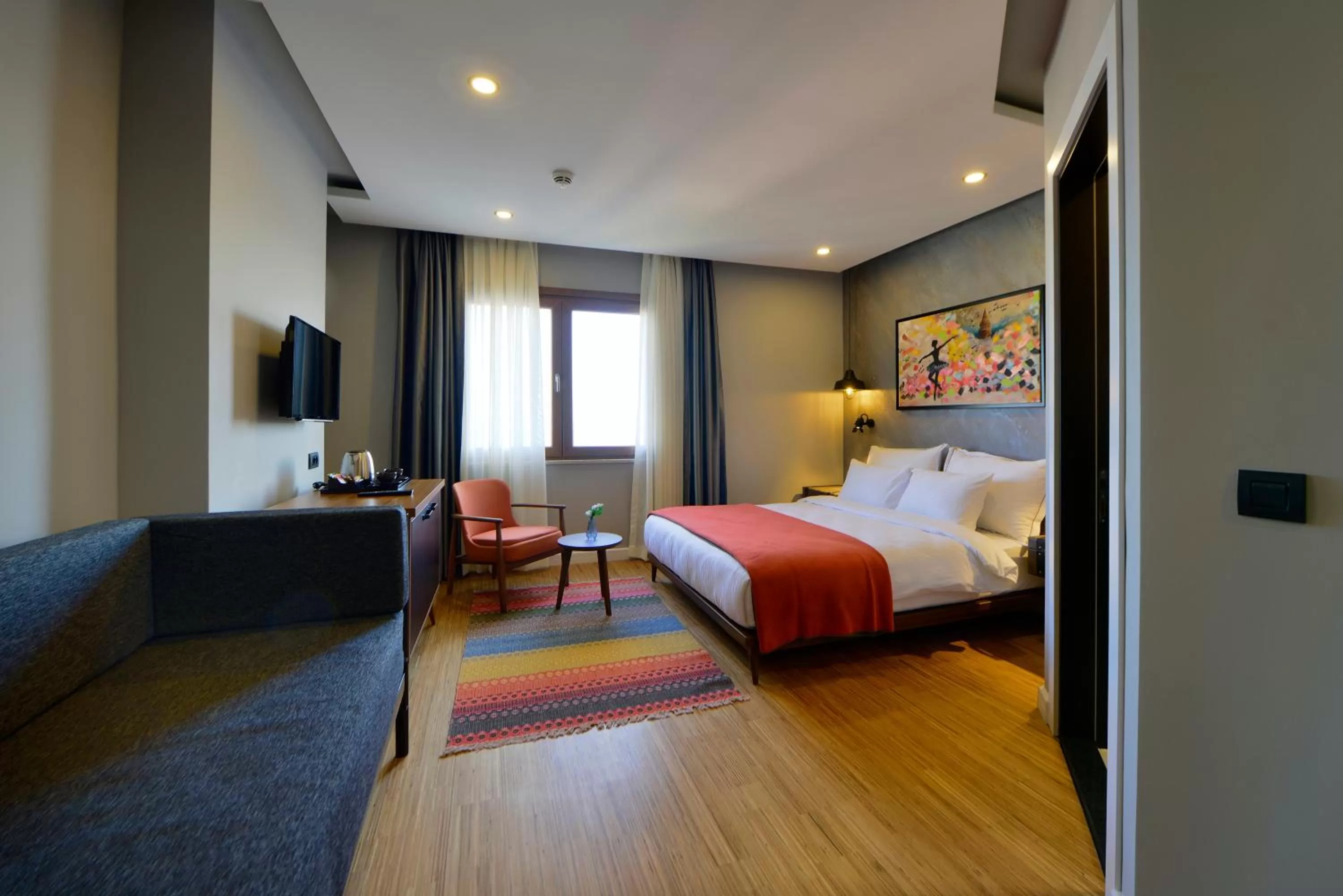 Photo of the whole room, Bed in Hotel Poem