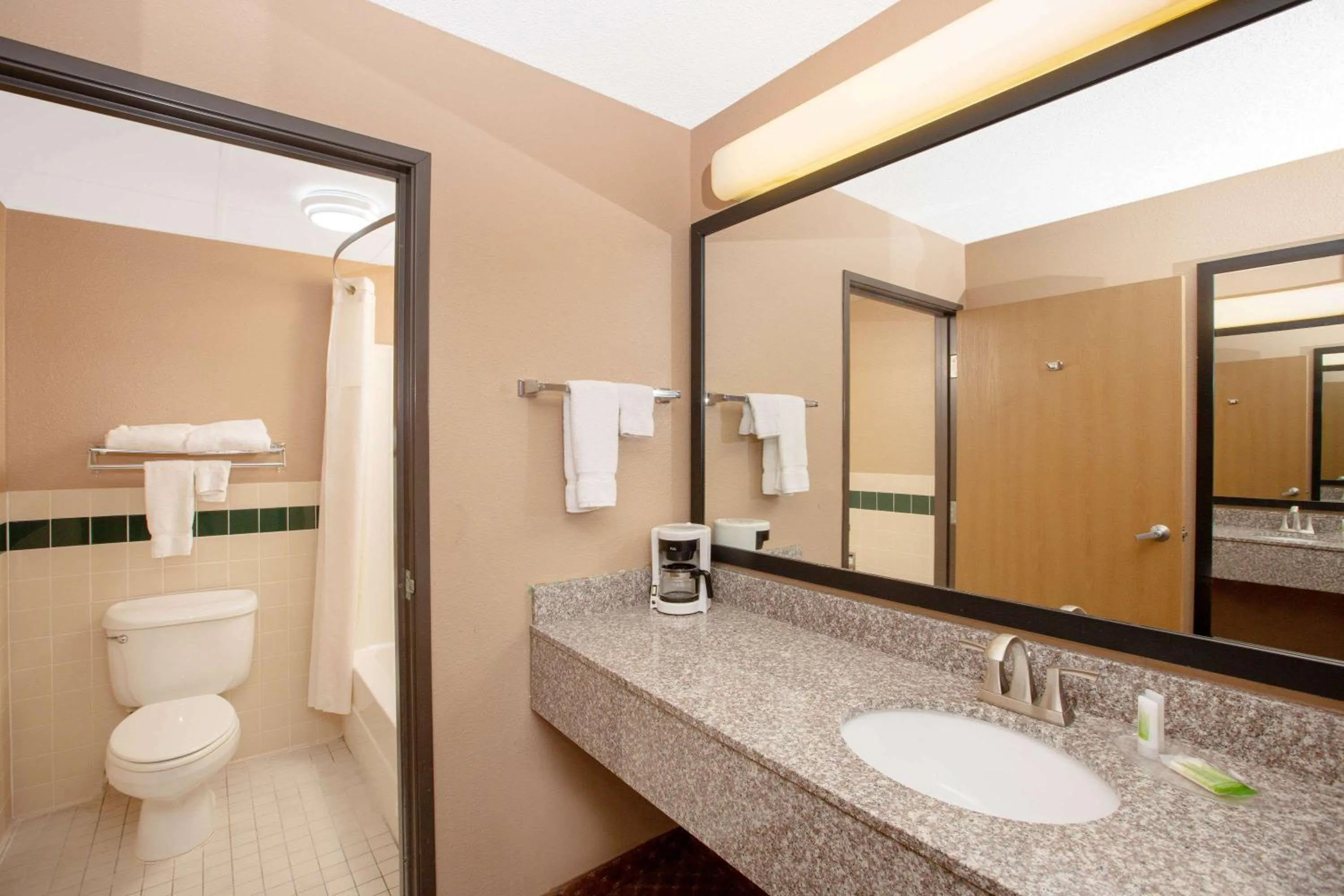 Bathroom in AmericInn by Wyndham Coralville