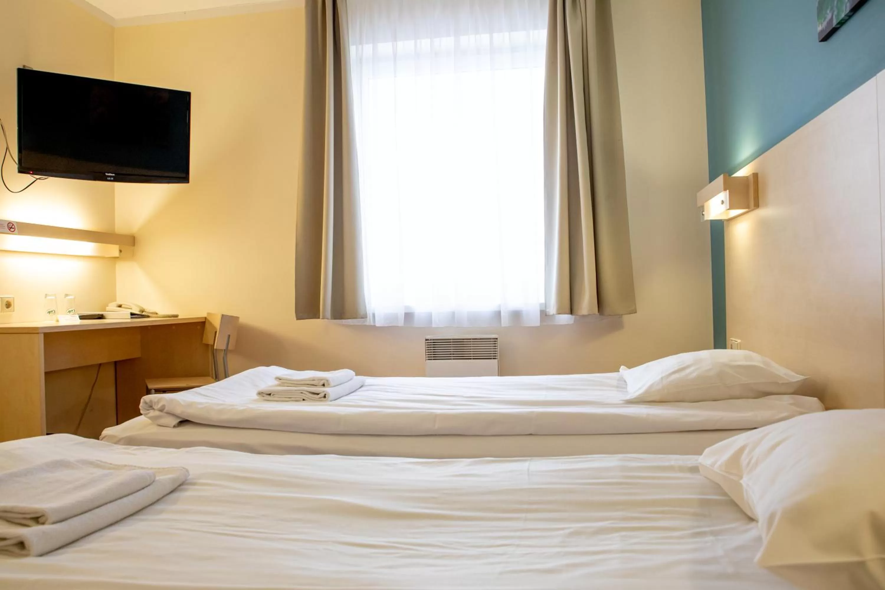 Bed in Rija Bauska Hotel