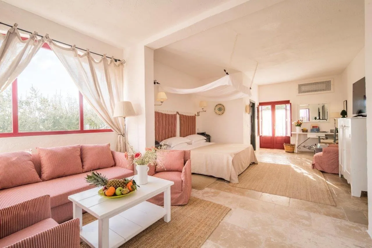 Seating area, Bed in Masseria Torre Coccaro