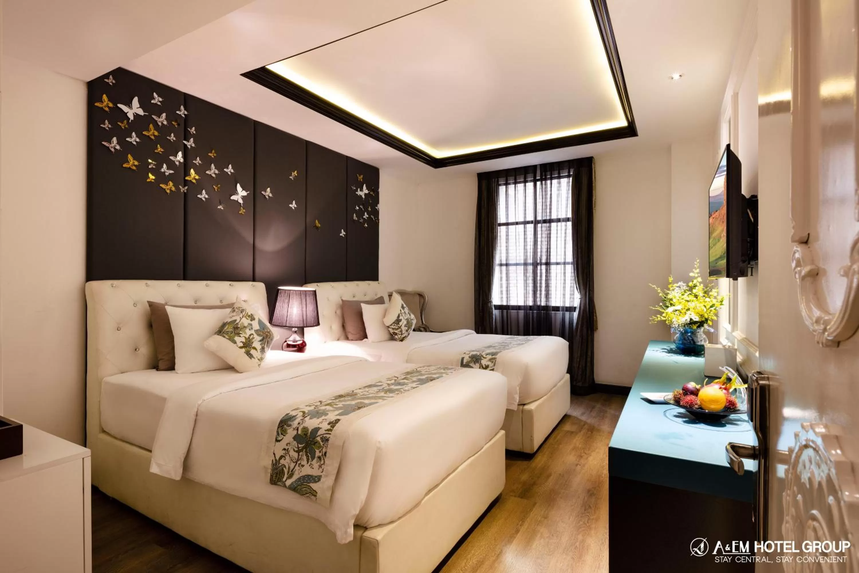 Bed in A&EM Saigon Hotel