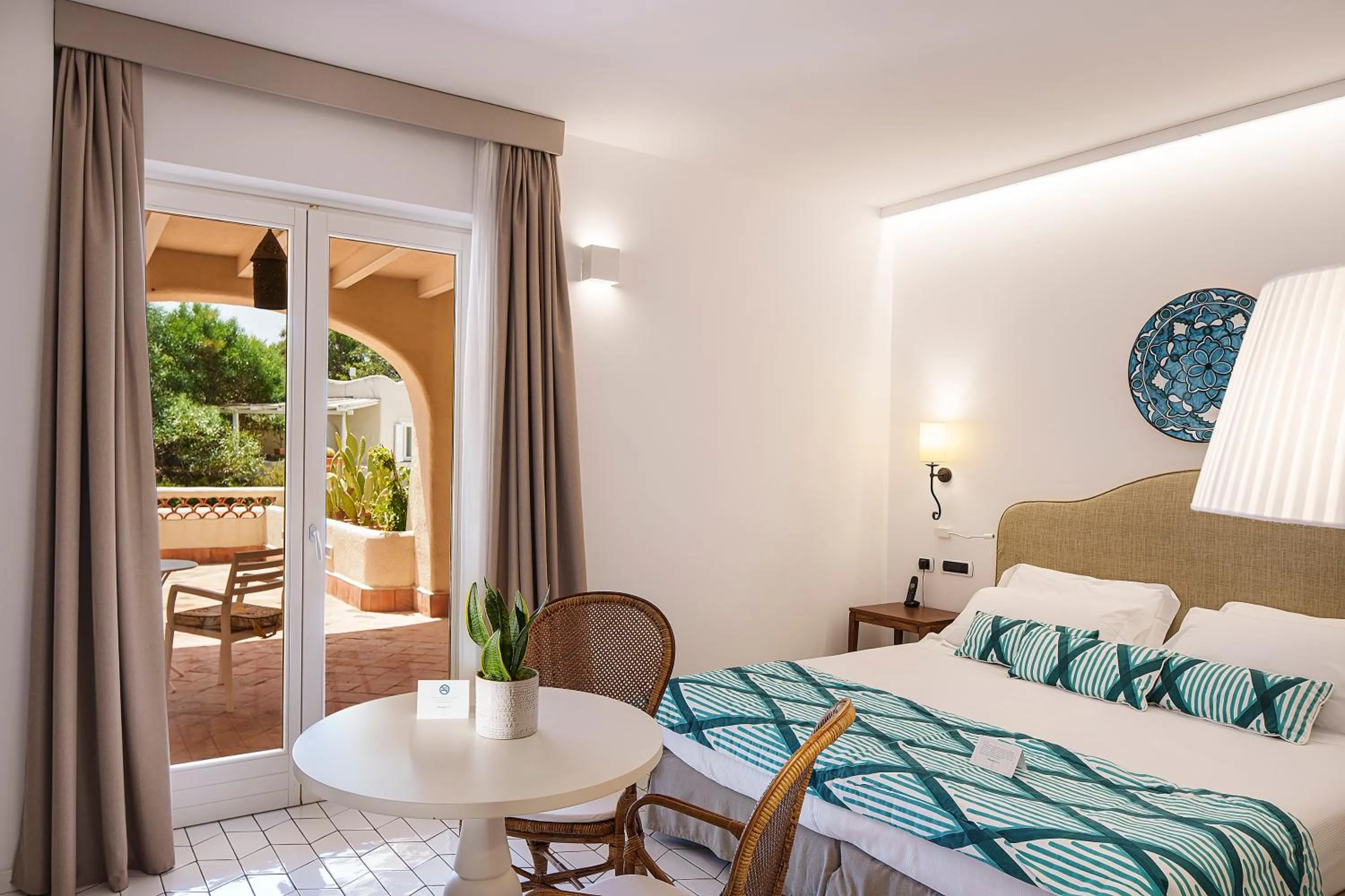 Bed in Therasia Resort Sea and SPA - The Leading Hotels of the World