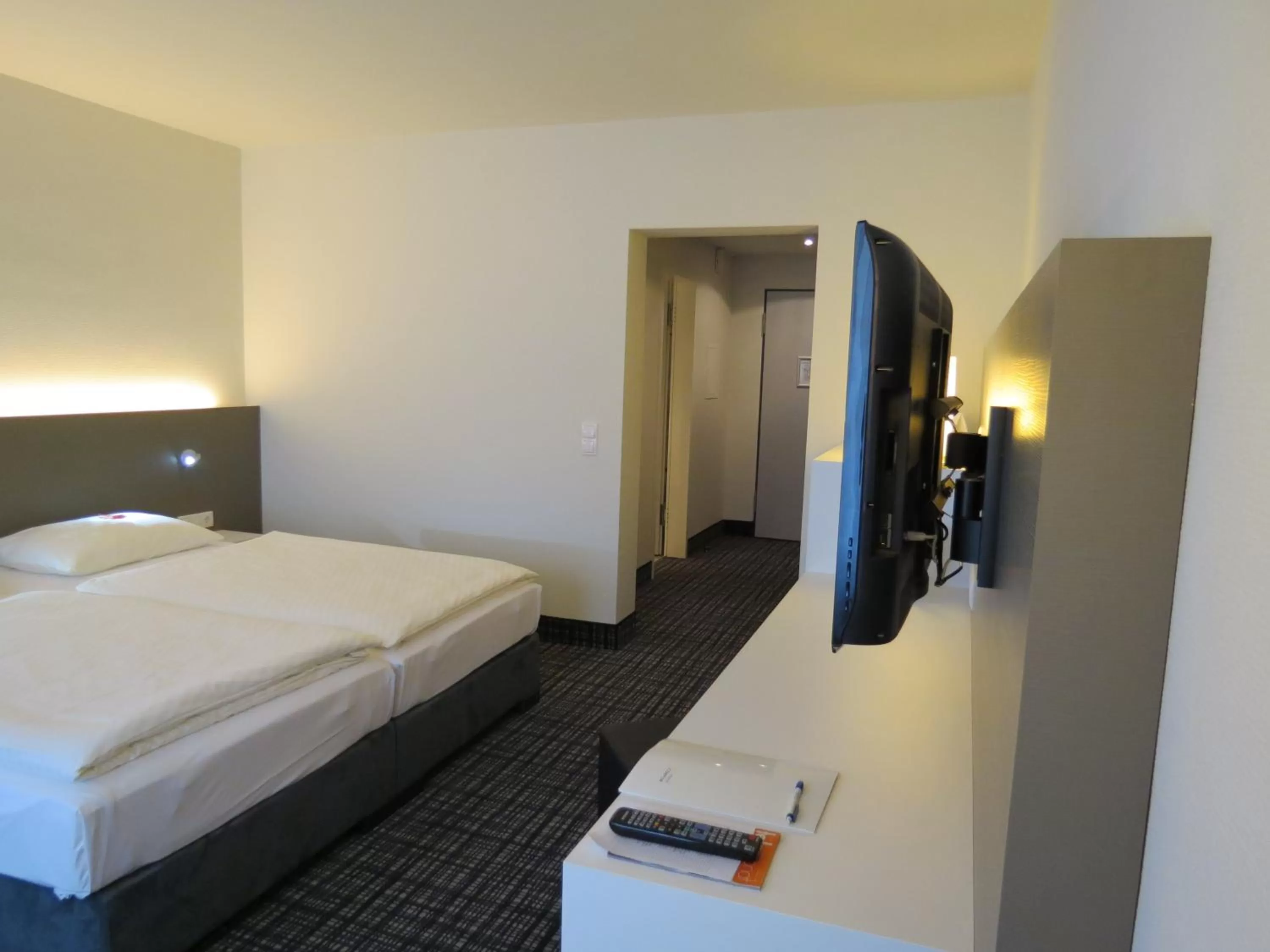 Photo of the whole room, Bed in Comfor Hotel Ulm City