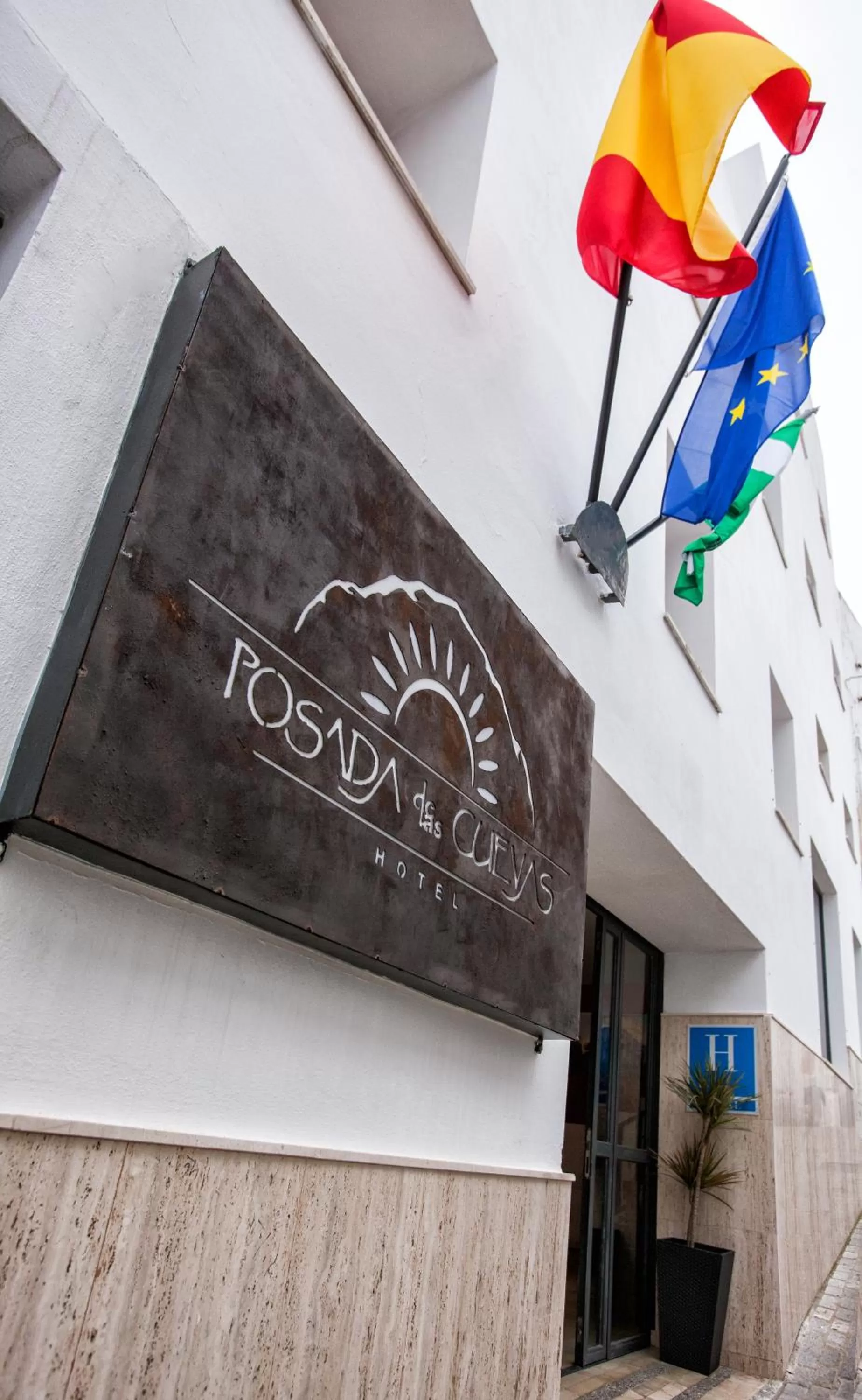 Property logo or sign in Hotel Posada de las Cuevas