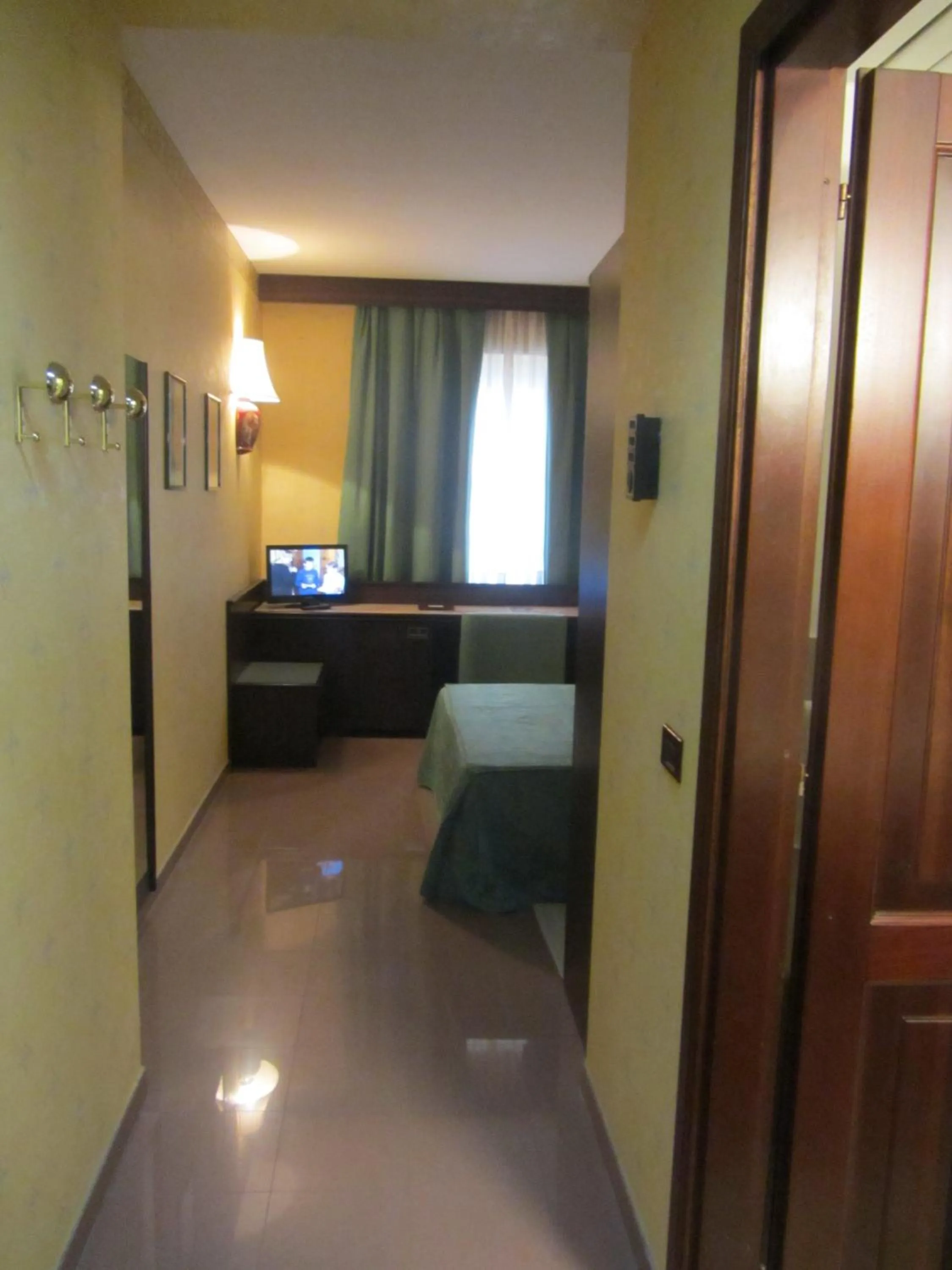 Bed in Hotel Leonardo Da Vinci