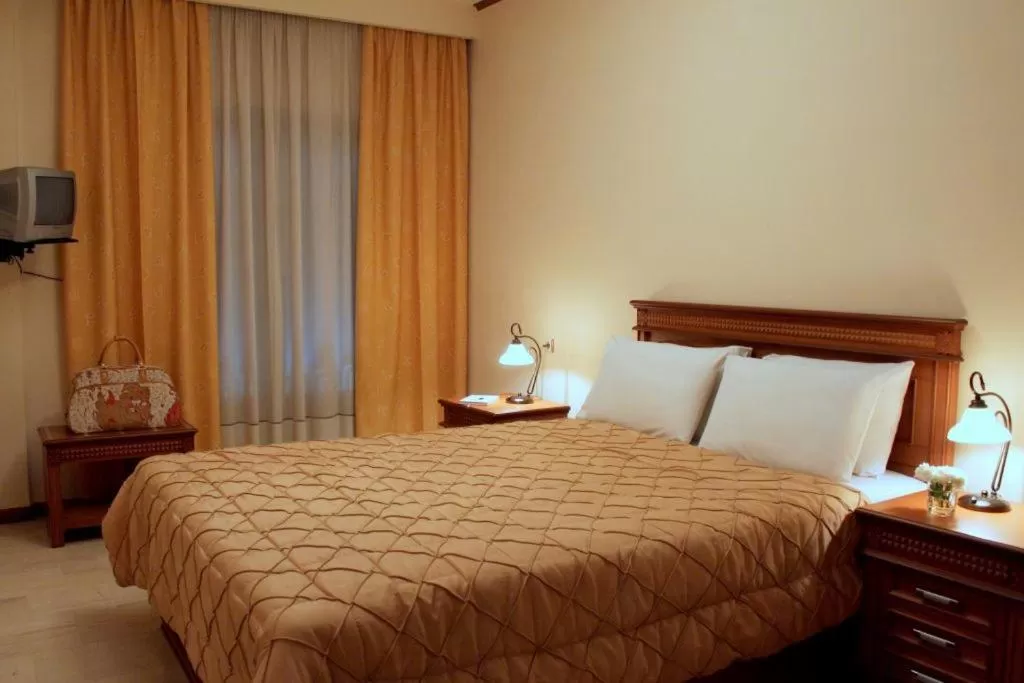 Bed in Famissi Hotel