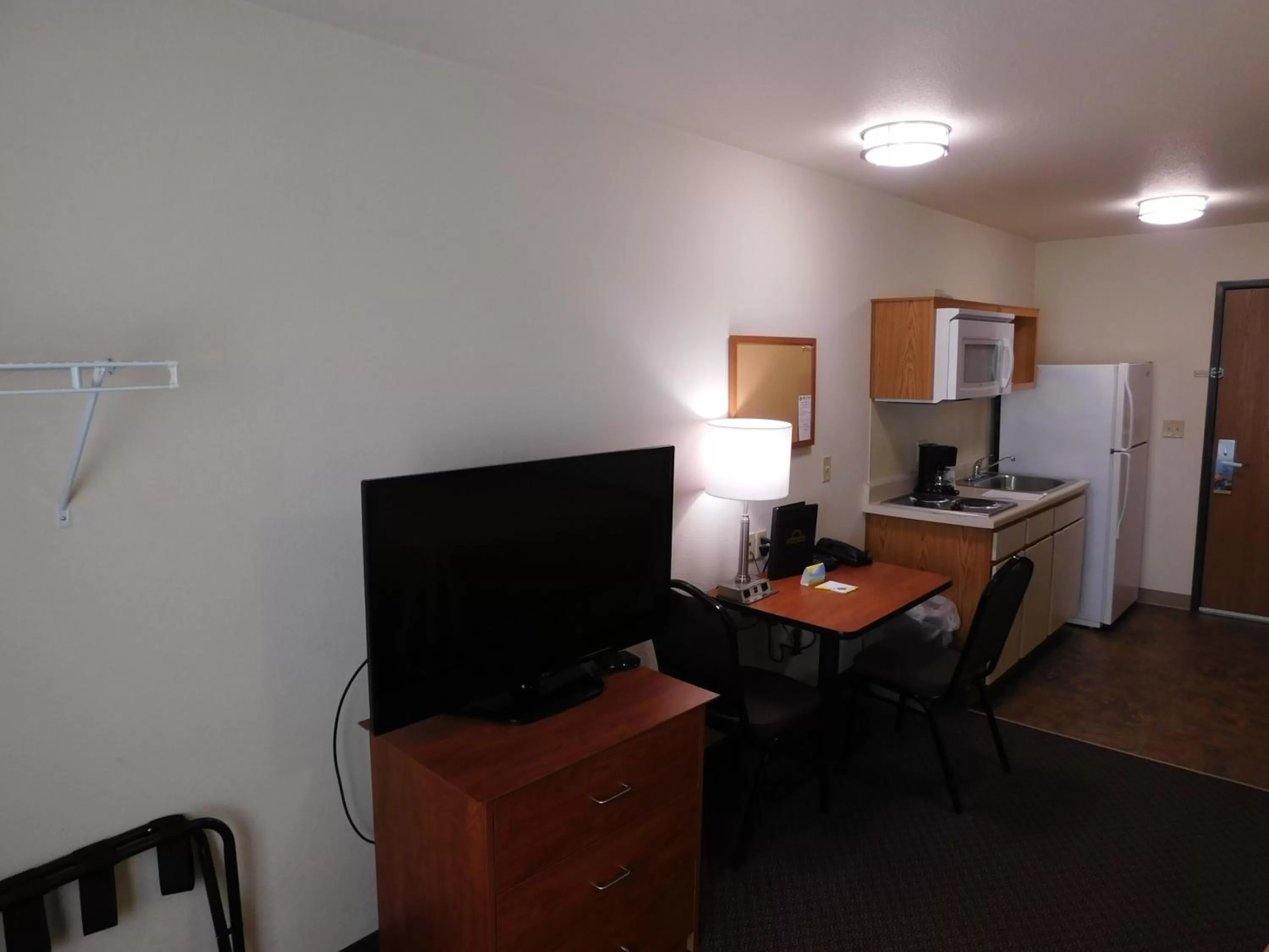 Kitchen or kitchenette in Days Inn & Suites by Wyndham Rochester South