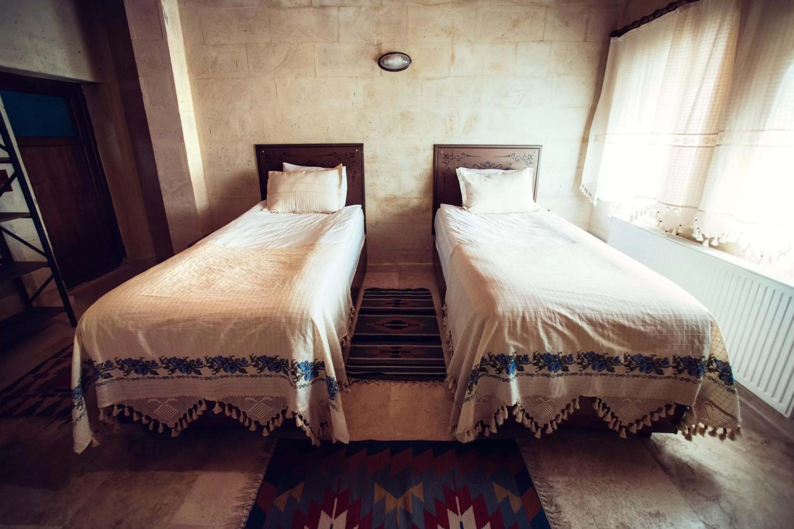 Bed in Azalea Terrace Cave Hotel