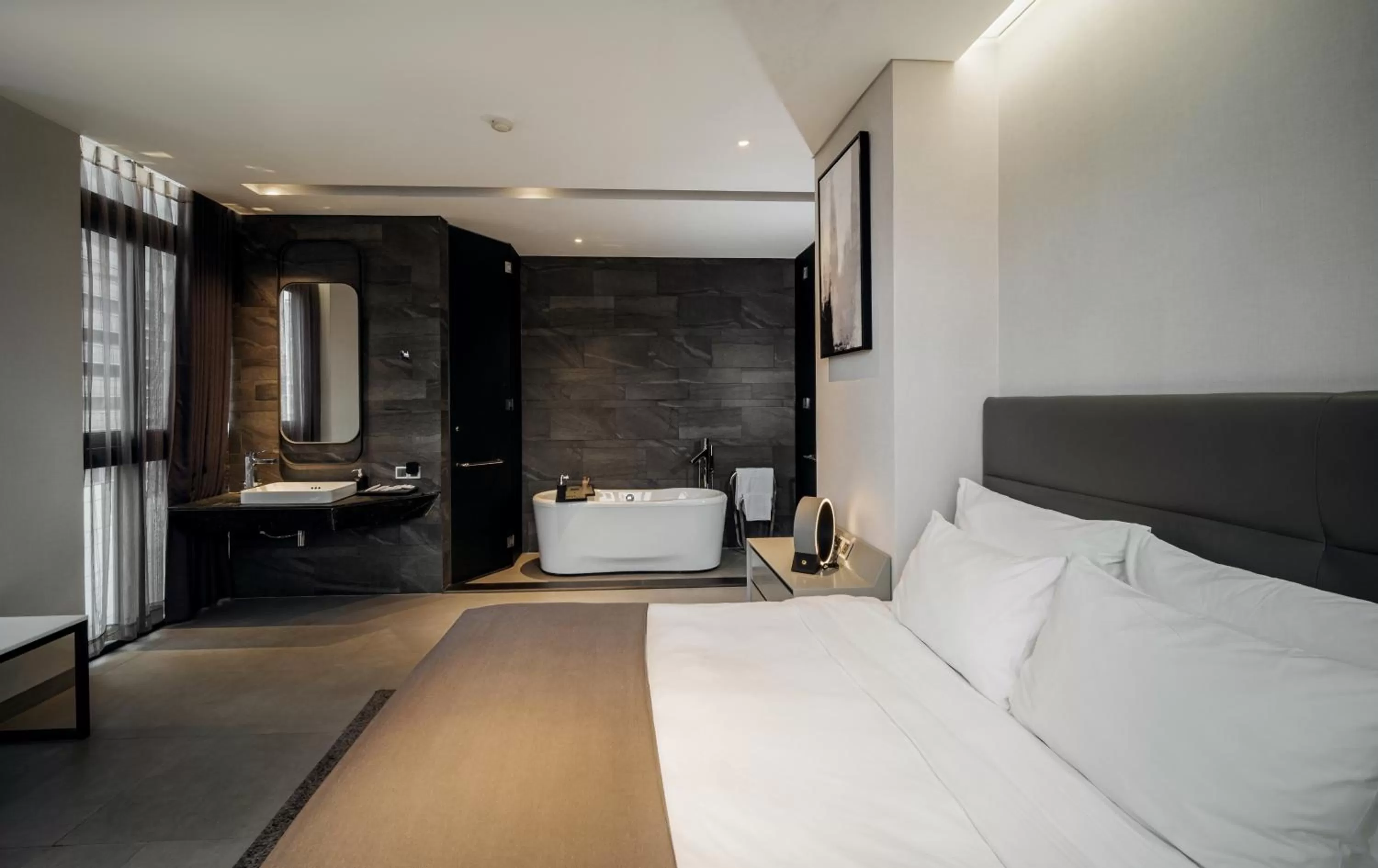 Bathroom, Bed in M Hotel Saigon