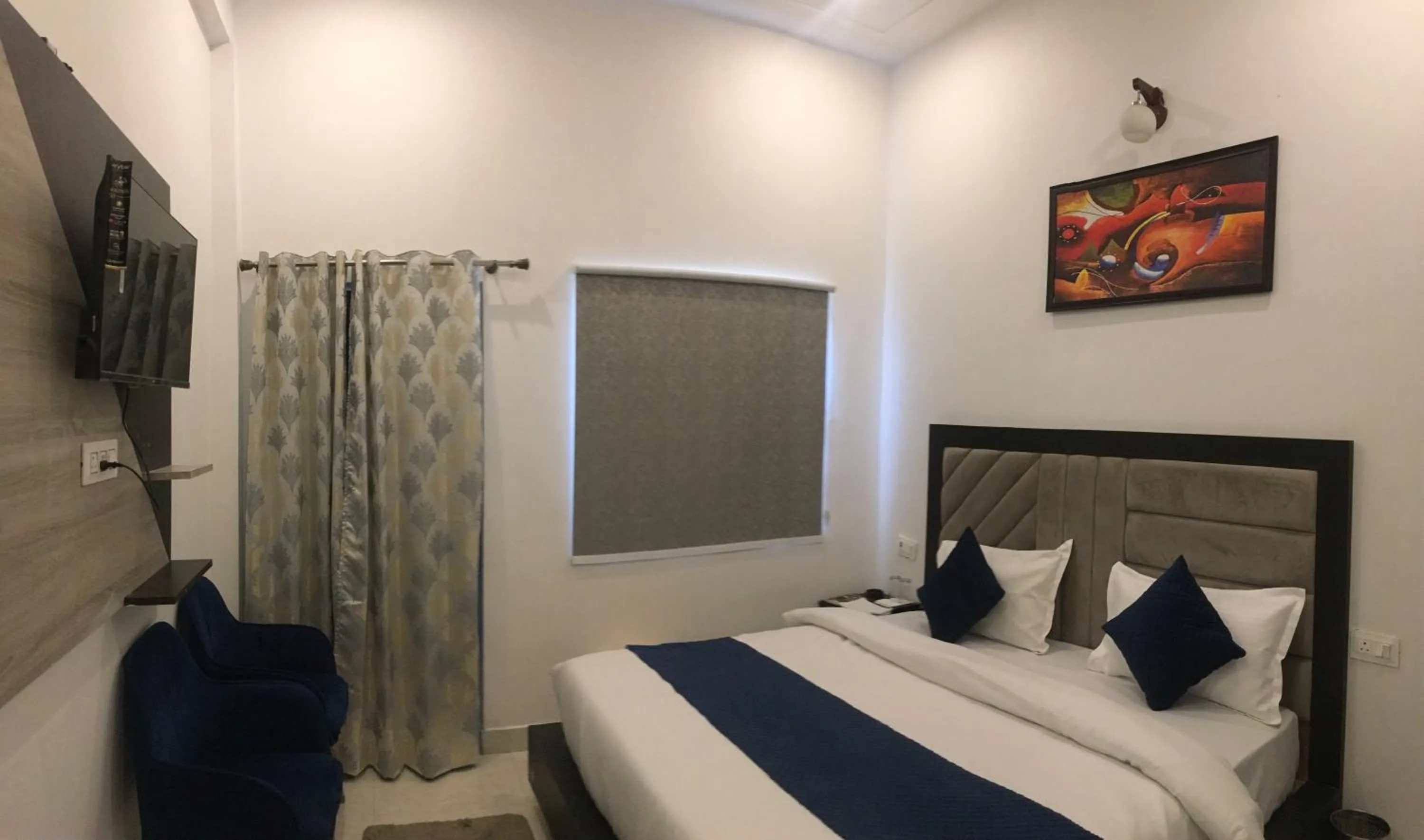 Bed in The nines hotel & restro