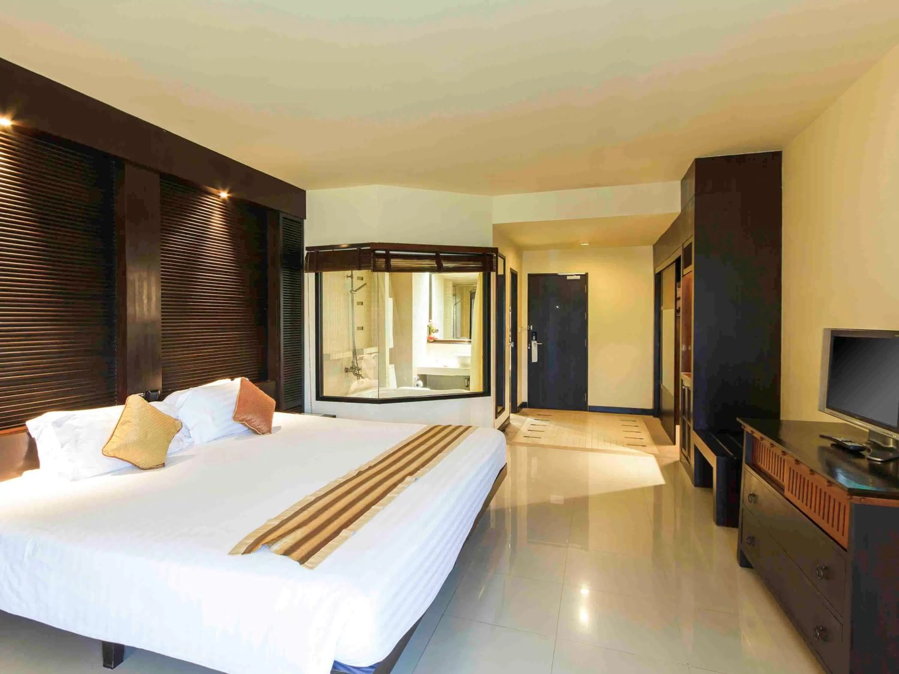 Photo of the whole room, Bed in The Nouveau Chumphon Beach Resort And Golf