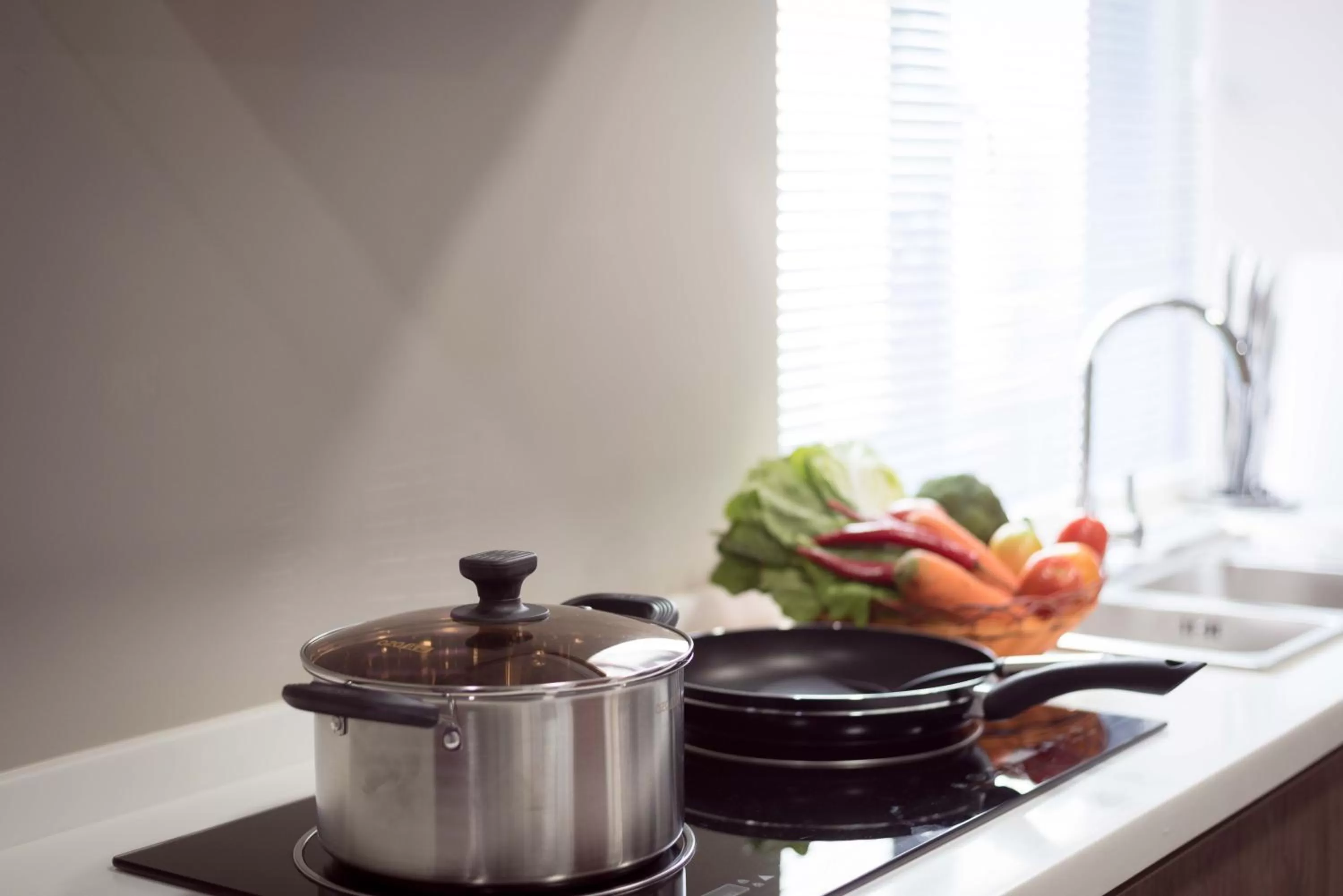 Kitchen or kitchenette in SOHO Residence
