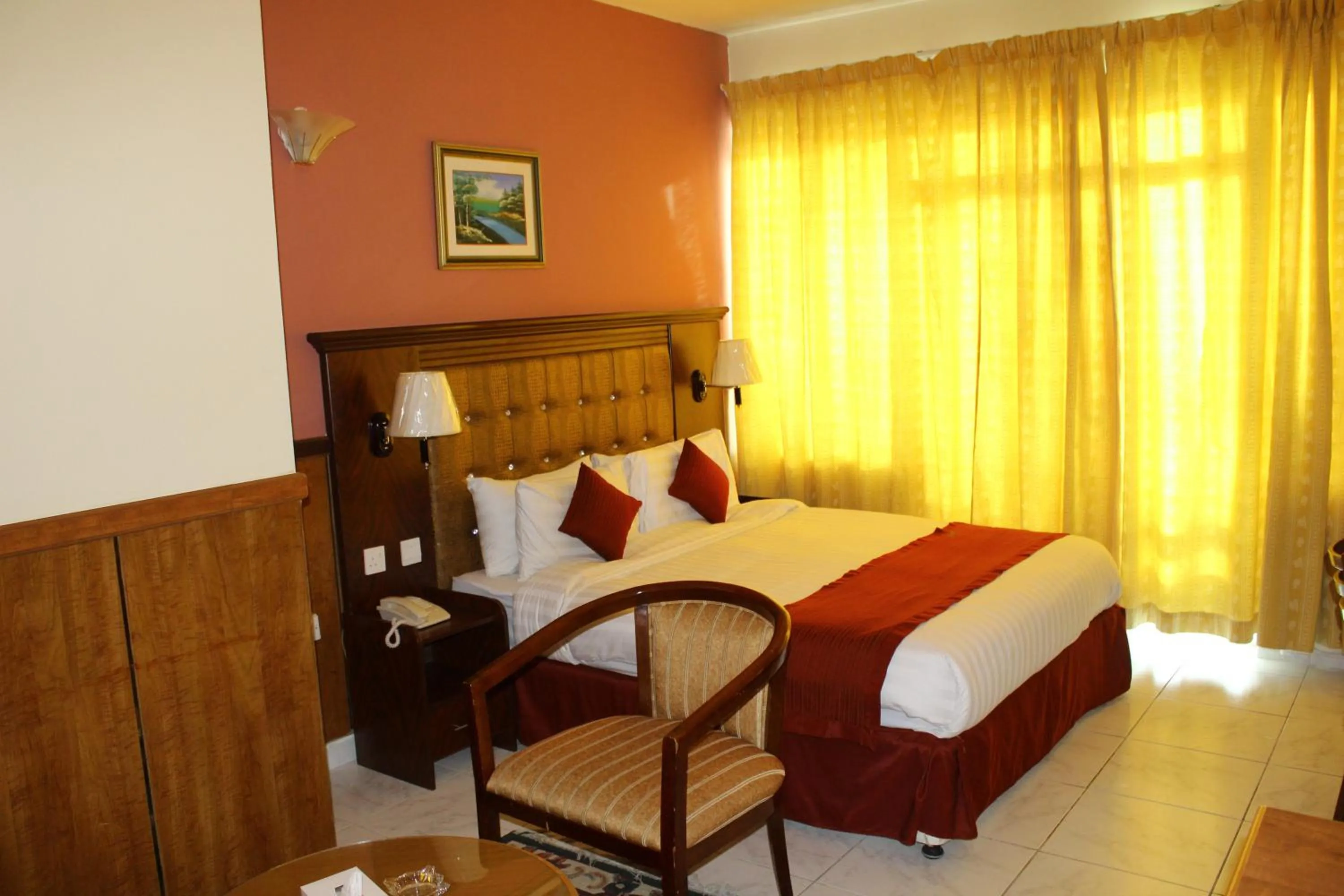 Bed in Grand Nova Hotel