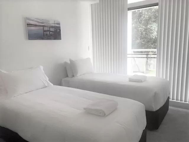 Bed in Sunrise Luxury Apartments