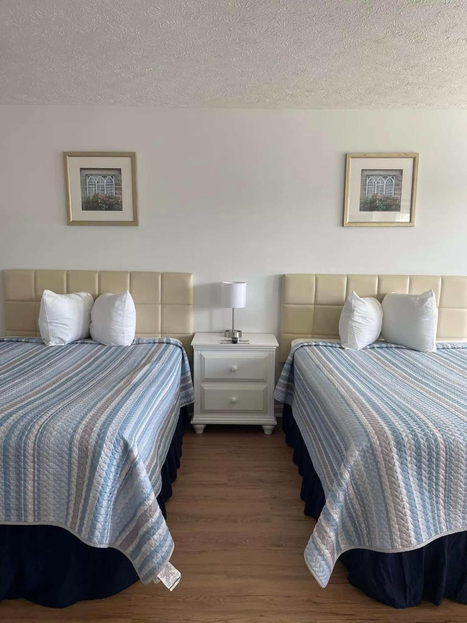 Bed in The Grand Beach Inn