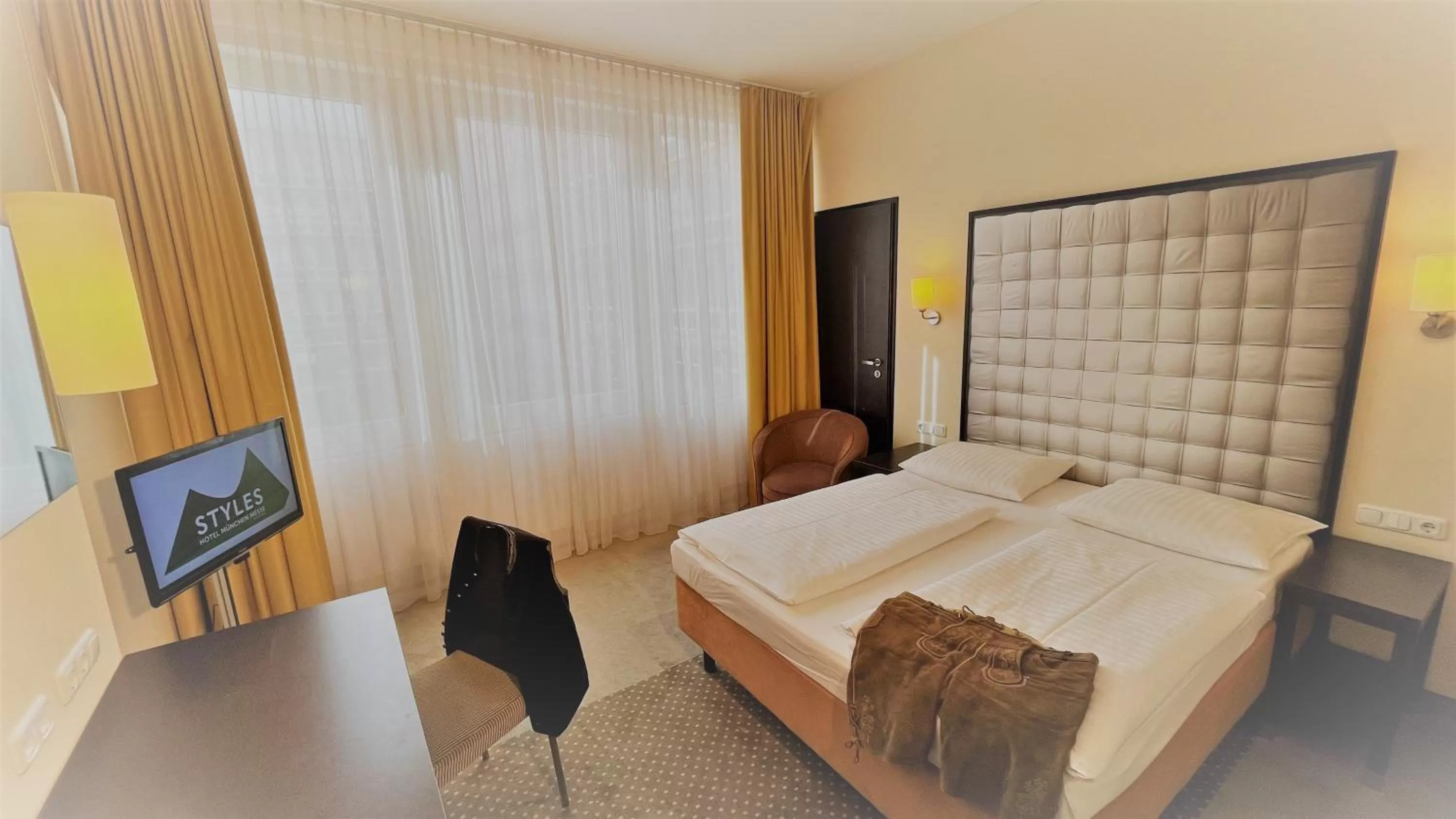 View (from property/room), Bed in Styles Hotel München Messe