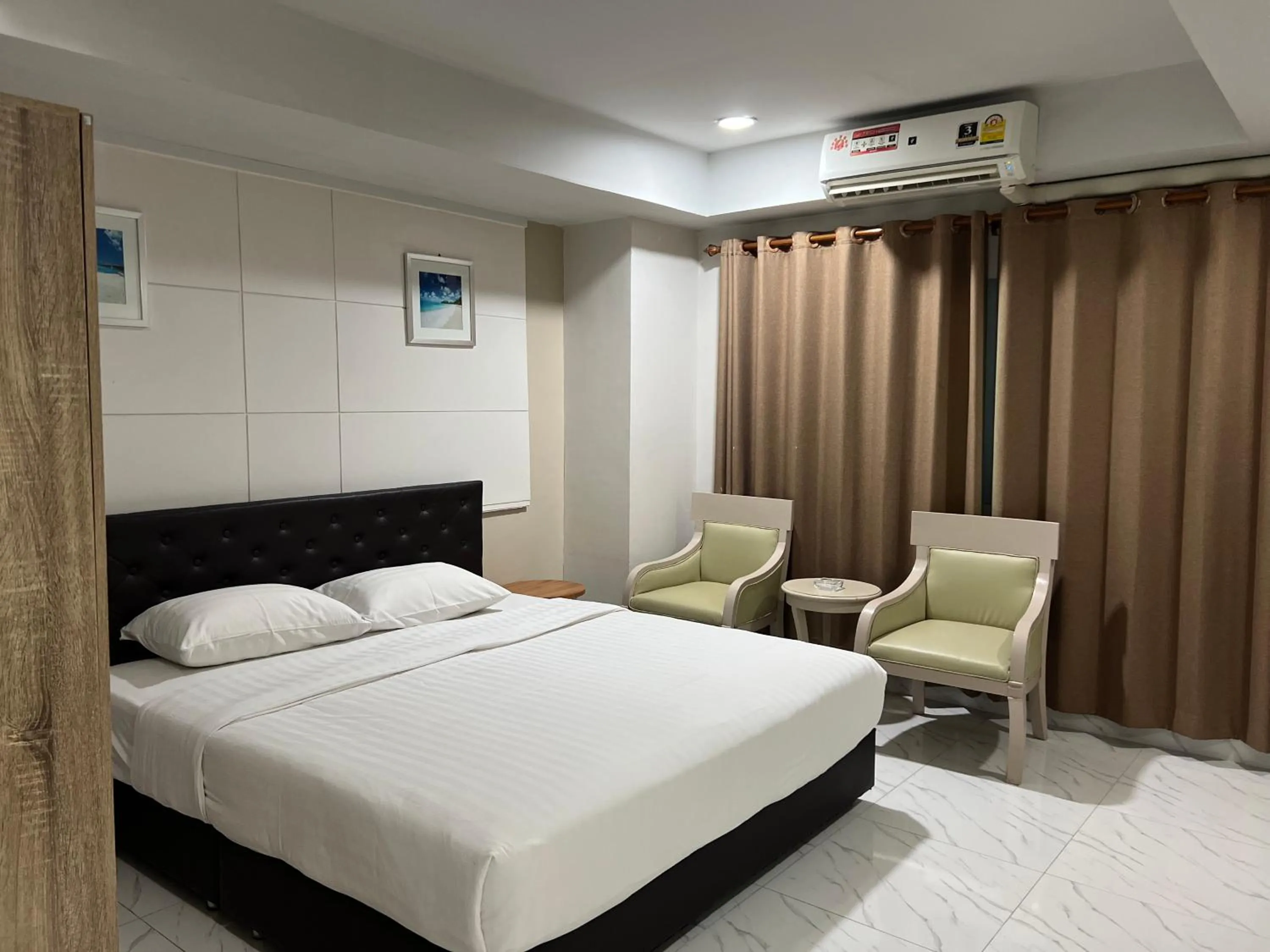 Bed in Mall Suites Hotel