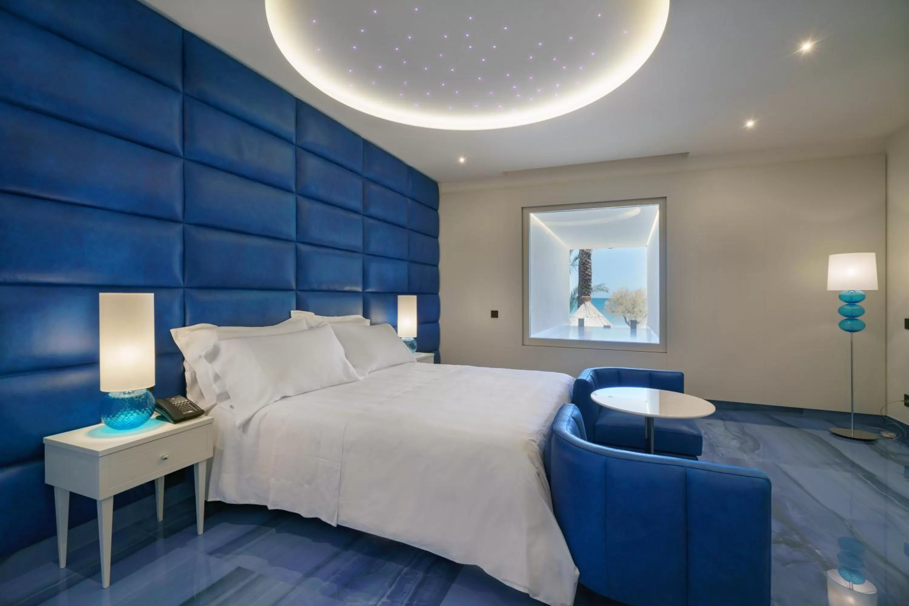 Bed in Grotta Palazzese Beach Hotel